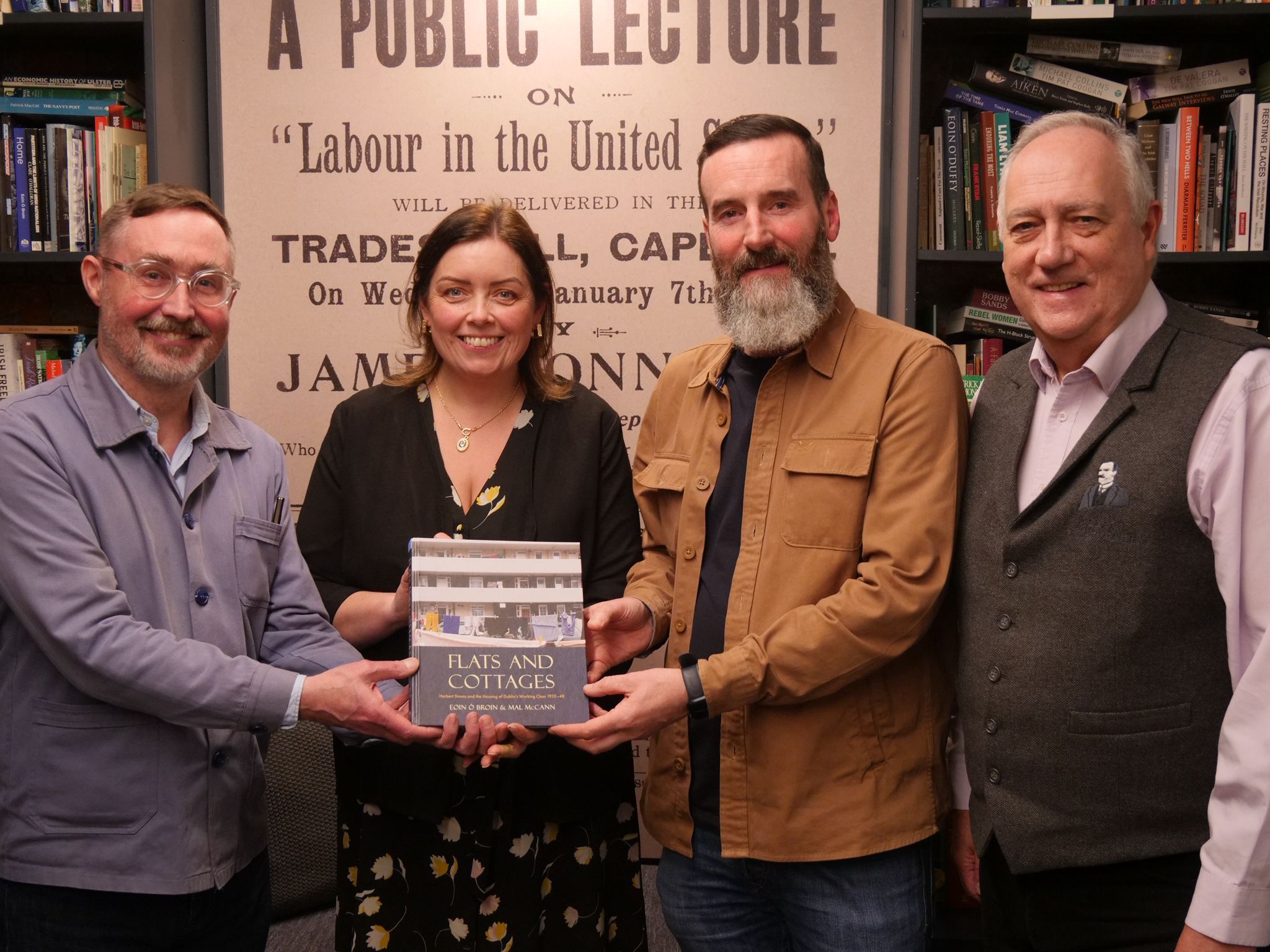 TRANSFORMATIVE POWER OF PUBLIC HOUSING: Launching \'Flats and Cottages\' in Áras Ui Chonghaile were Eoin Ó Broin TD, Deirdre Hargey MLA, Mal MCann and Séanna Breatnach