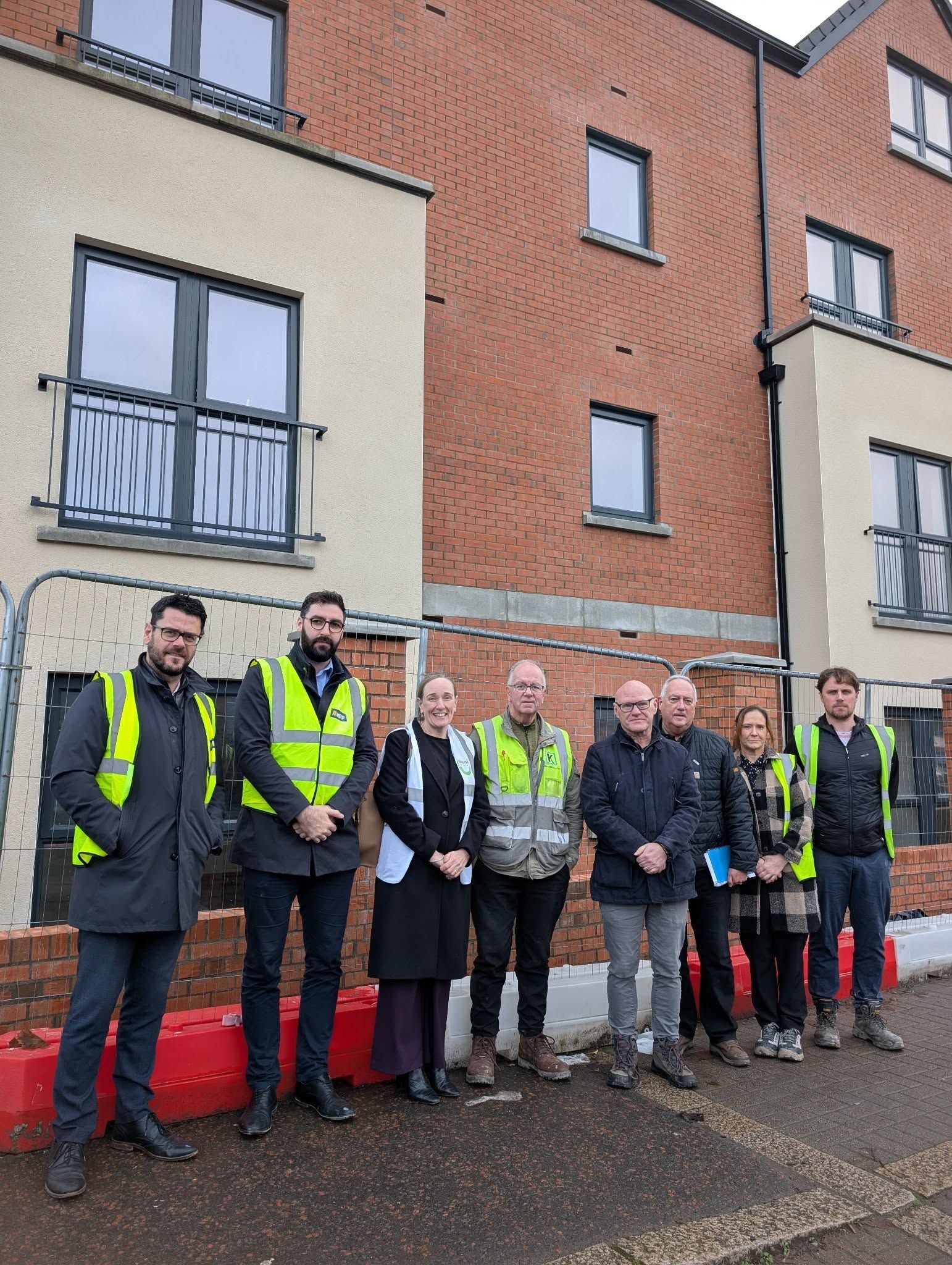 VISIT: Sinn Féin representatives with staff from Clanmil Housing at the new Kingsway site in Dunmurry