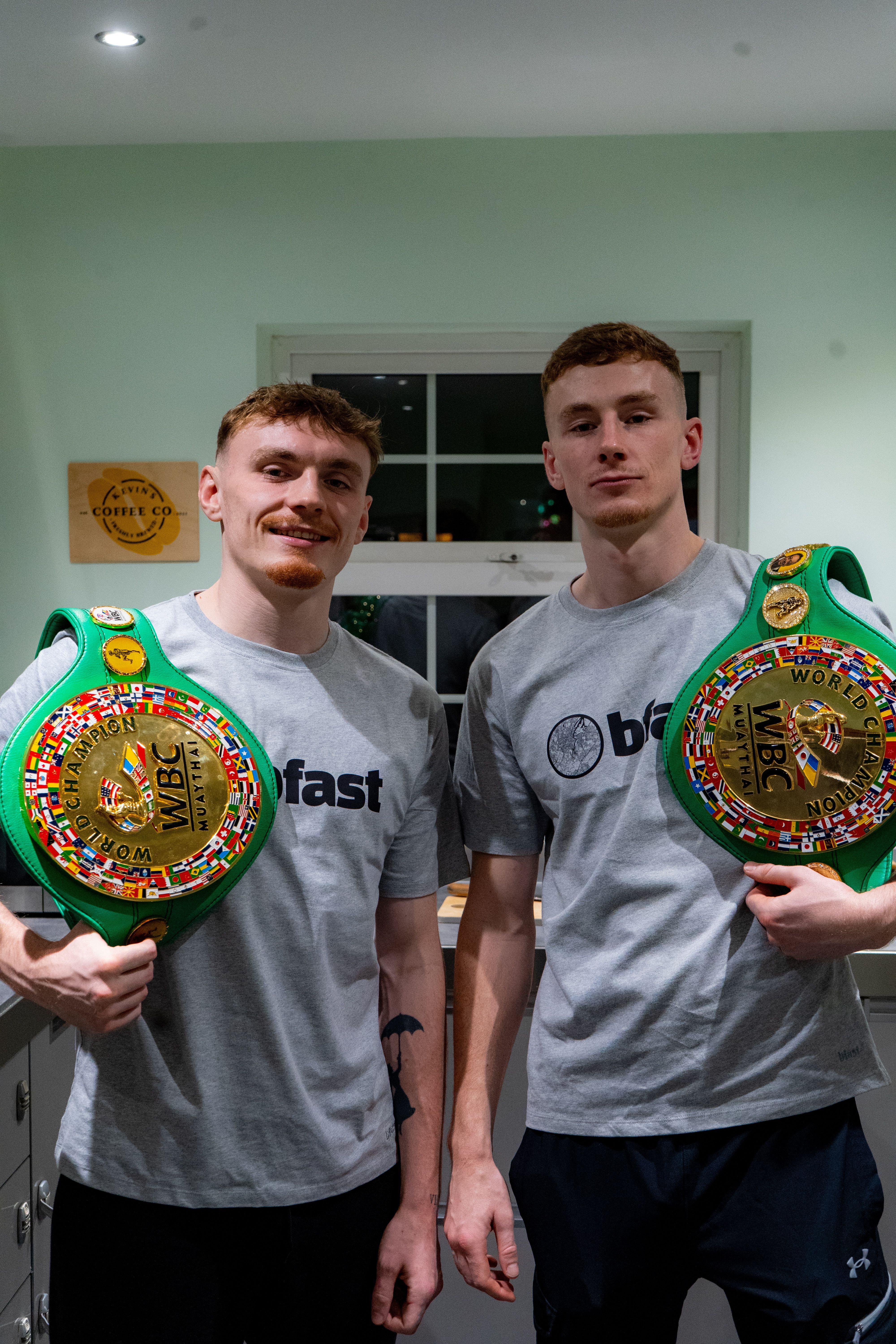 BEST MATES: Garrett Smylie (left) and Niall McGreevy (right) holding their WBC title belts