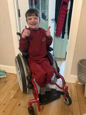 Smiles from Dáithí as his wheelchair is returned