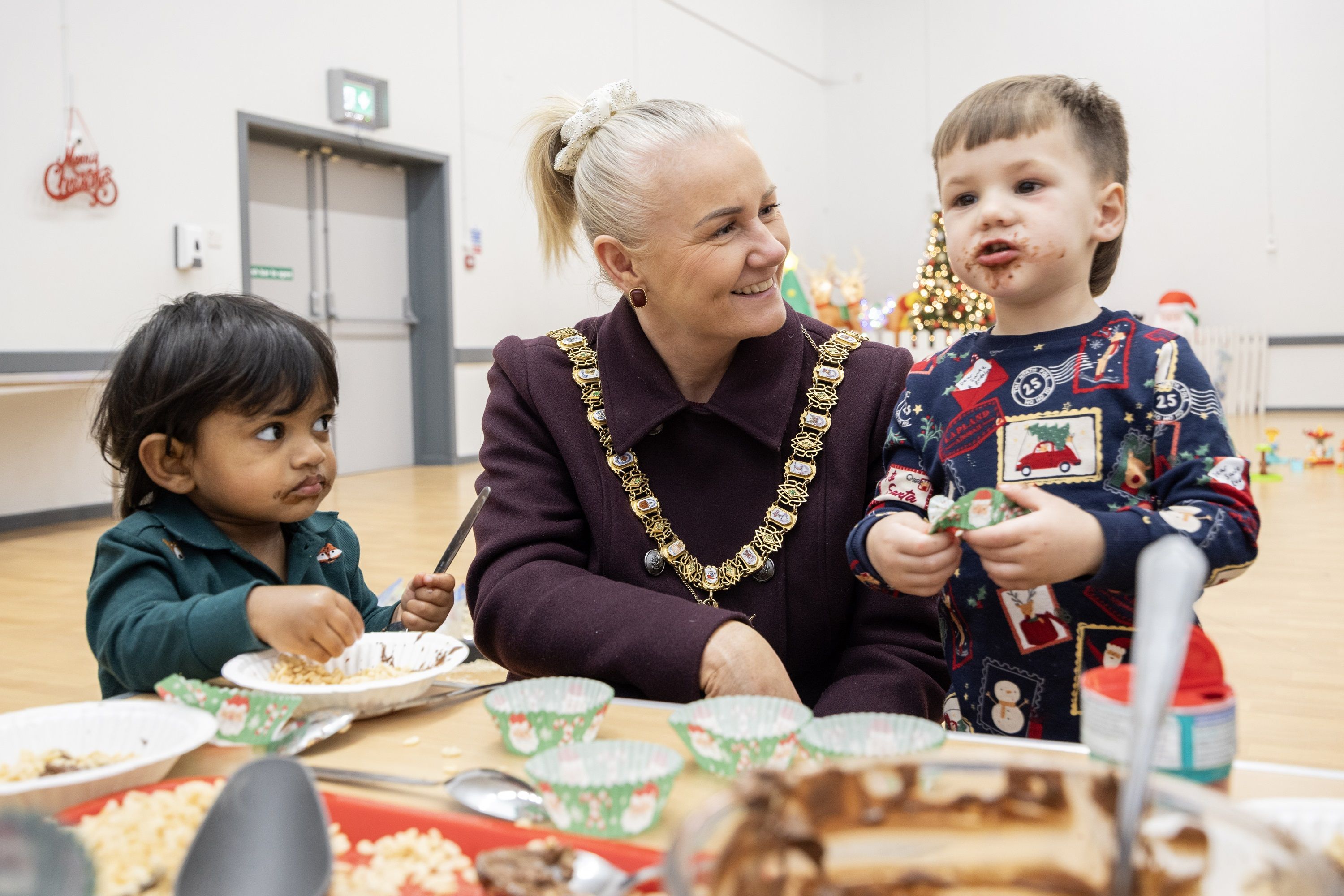 CHOICE: Lord Mayor Councillor Tracy Kelly with Enzo Wilson and Evin Abhinav at South Belfast Sure Start’s Twilight Créche in Donegall Pass Community Centre