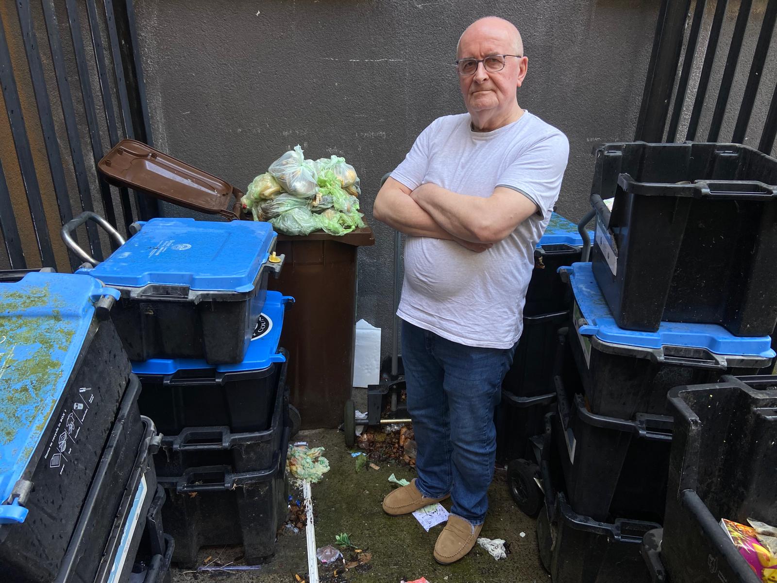 WHAT A WASTE: Joseph O’Hare at the overflowing bin