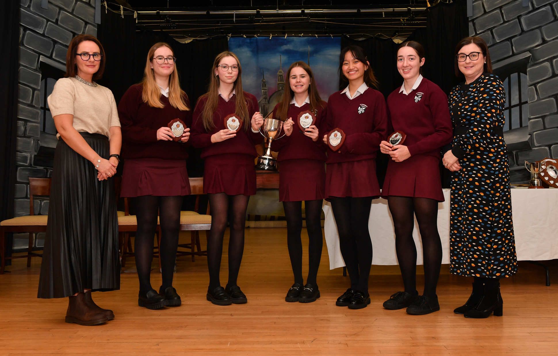Abigail Mayock, Lucy McAloon, Grace McNamee, Emma Meenan and Katrina Villasfer receive the Mother Laurentia Corr Trophy for 9A*s or more with Dr Nichola Booth and St Dominic’s Principal Mrs O’Neill