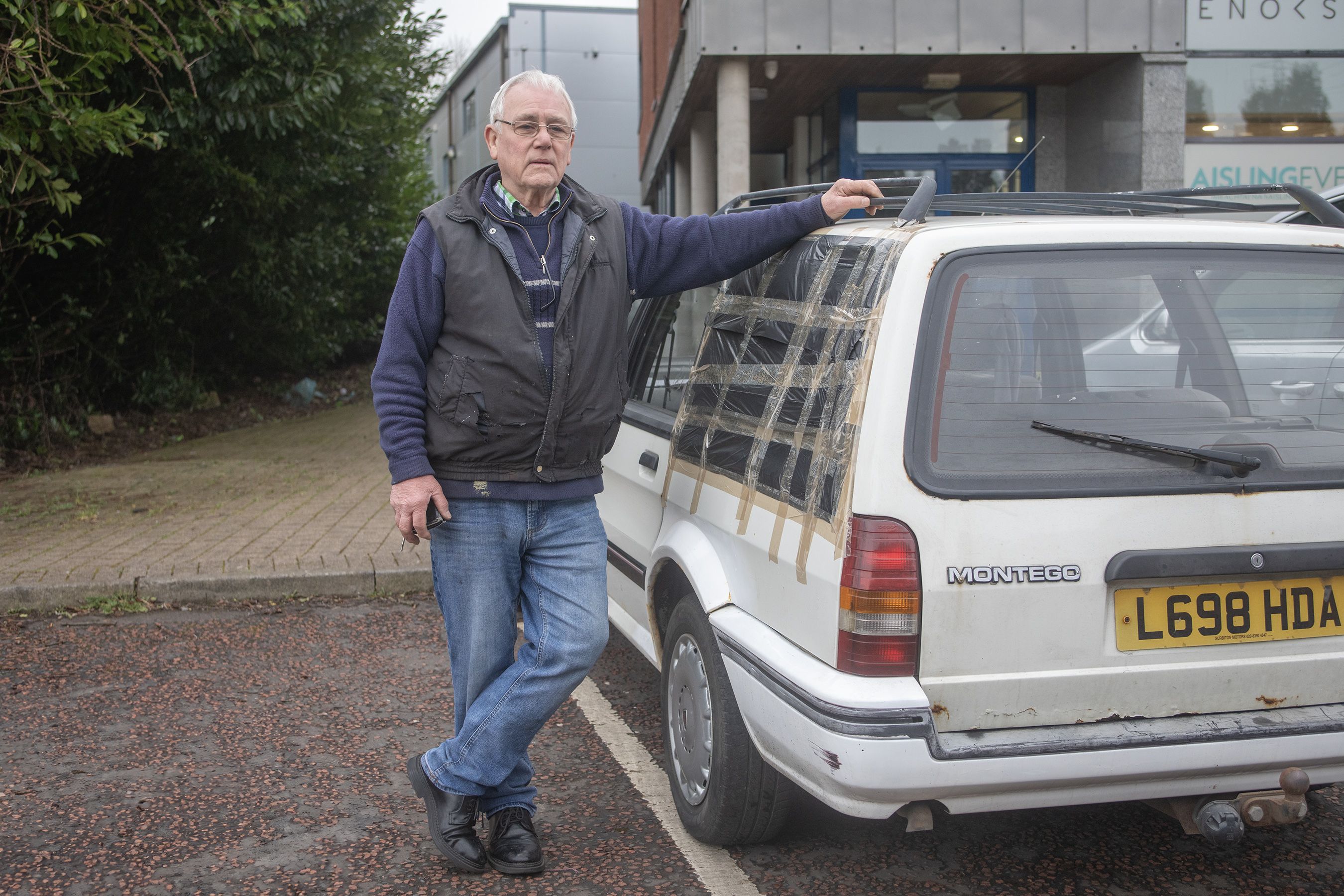 ANGER: Robert Mateer with his Rover Montego which was damaged