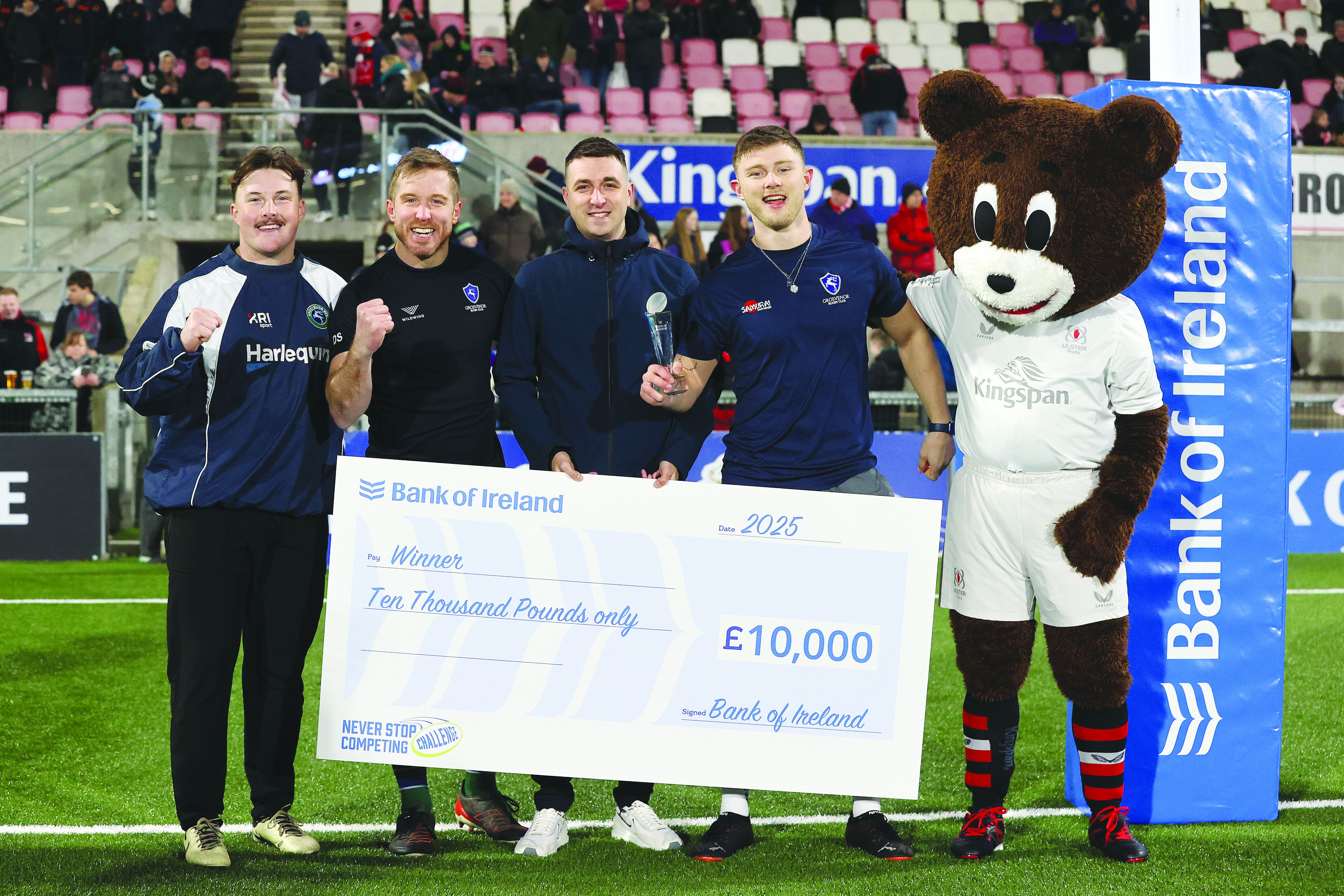 The Grosvenor RFC team of Ben Davies, Dean Swift and Jack Kennedy with Matthew Cross from Bank of Ireland’s Andersonstown branch who presented the £10,000 prize, along with Sparky, the Ulster Rugby mascot