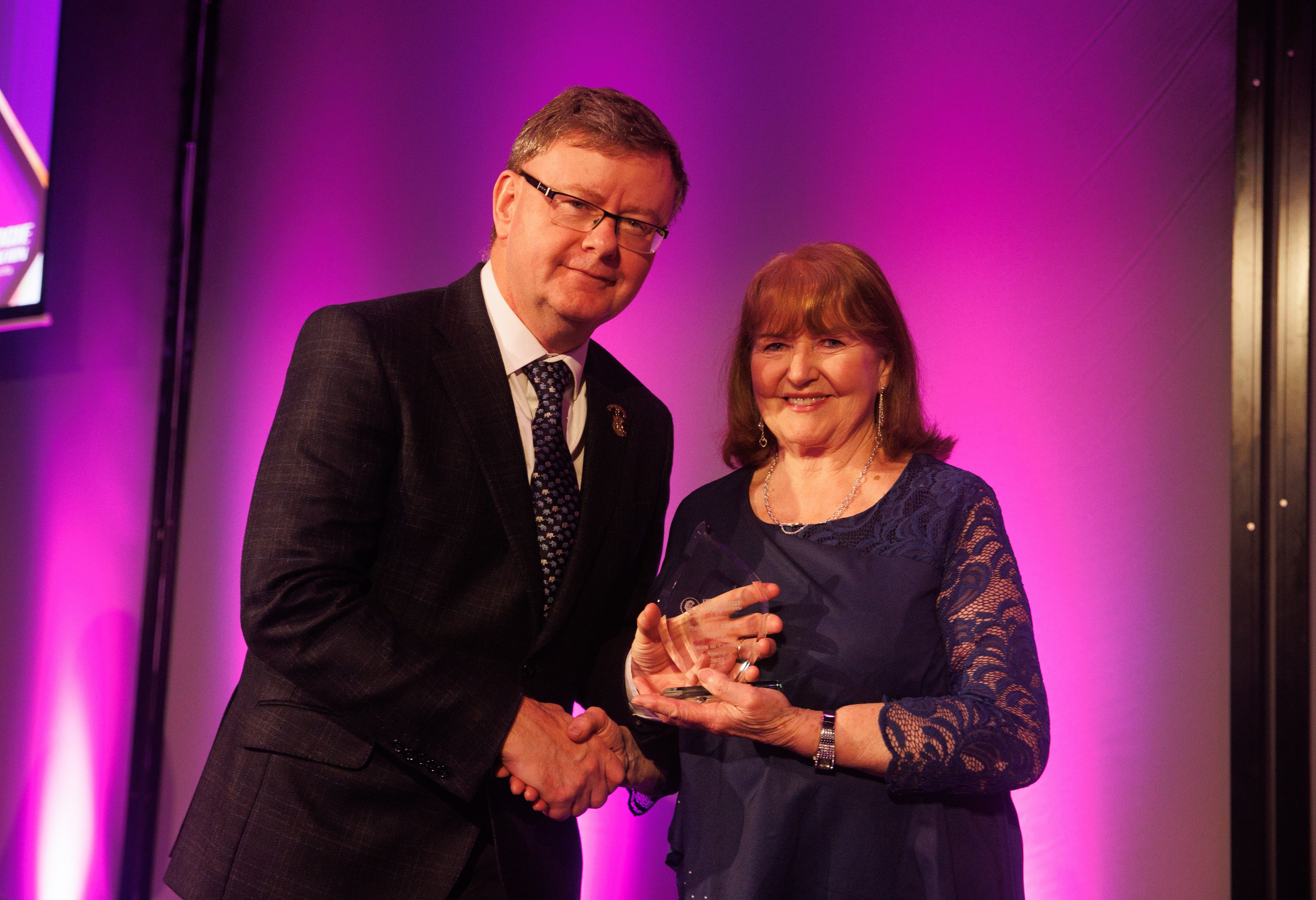 Humans of Camogie Award winner Margaret Flynn of O\'Donovan Rossa Camogie Club with Uachtaran of the Camogie Association Brian Molloy