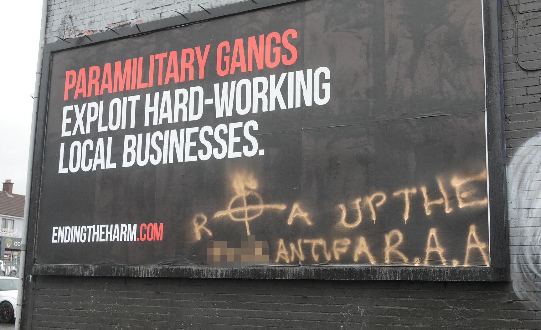 \'INSULTING\': The DoJ billboard is in the heart of the Andersonstown commercial district