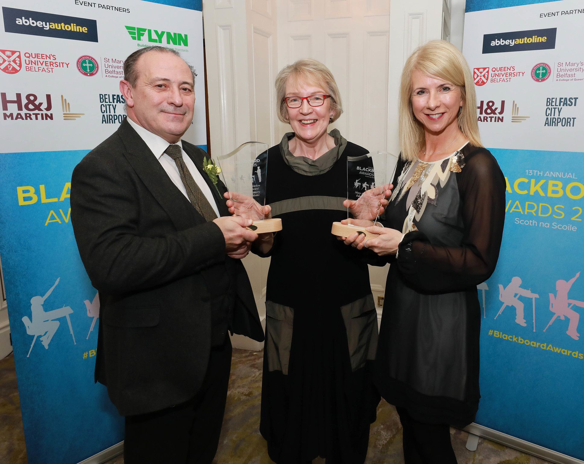 Paul McBride (St Malachy's College) and Mary Montgomery (Belfast Boys' Model) are presented with the 'Mary Ann McCracken Educational Award' by Norma Sinte (Chair of Mary Ann McCracken Foundation) 