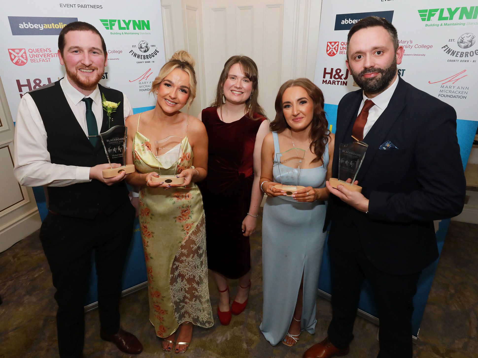 Michael Smith (St Mary's CBGS), Cailín Fox (Bunscoil Phobal Feirste), Niamh Doyle (Gaelscoil an Lonnáin) and Paul Brennan (Edmund Rice College) with Kerry Reid (Head of Marketing, H&J Martin) 