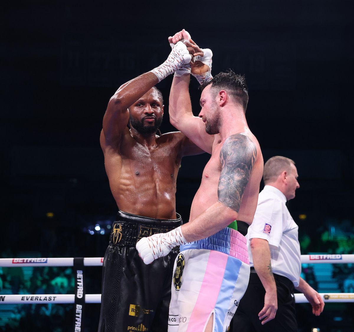 Craig Richards and Padraig McCrory embrace after the Londoner\'s win