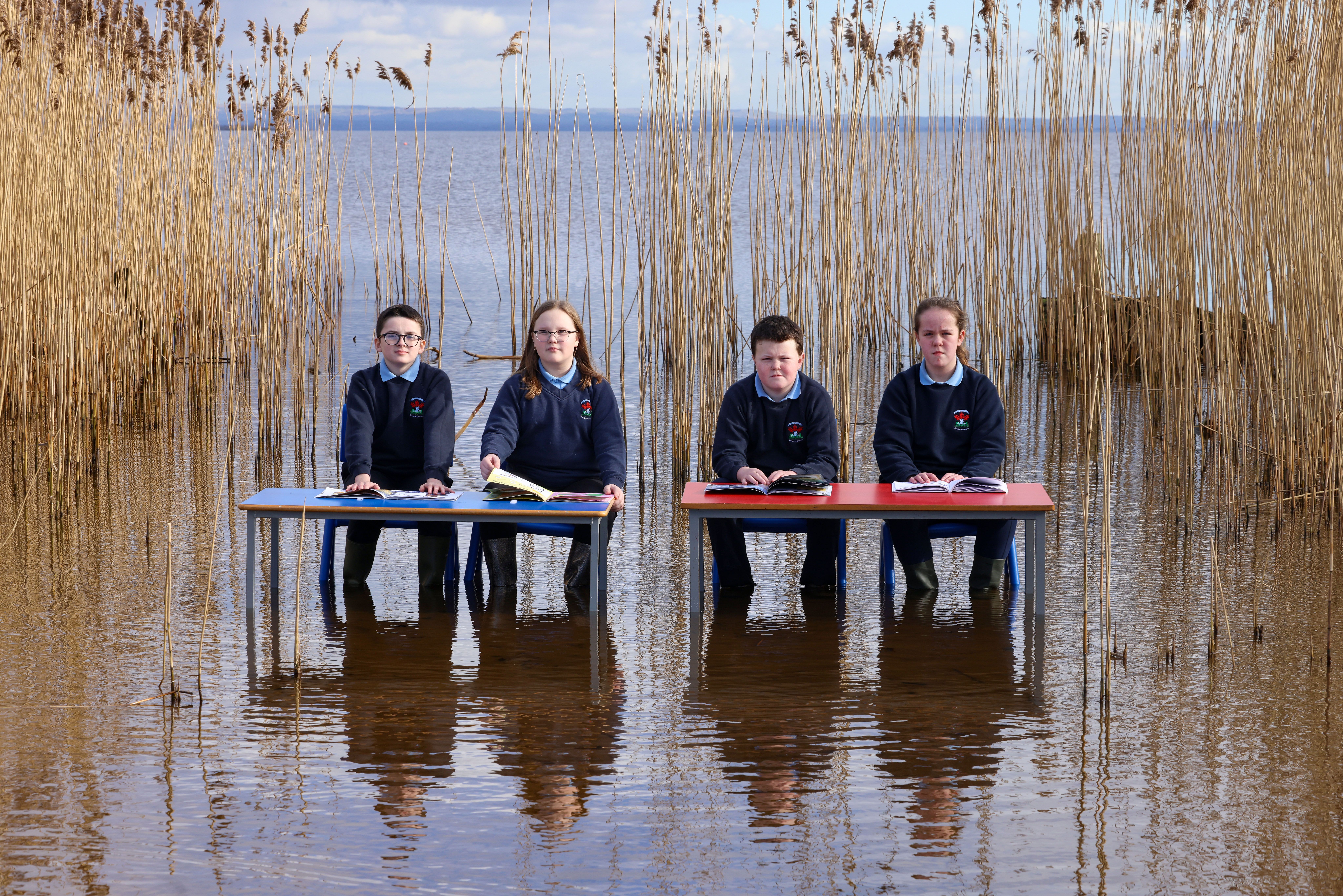 MESSAGE: P7 pupils from St Trea’s Primary School in Ballyronan, Luke, Abigail, Tommy and Aobha took to Lough Neagh to launch this year\'s annual Trócaire appeal and raise awareness of the education washout due to climate change