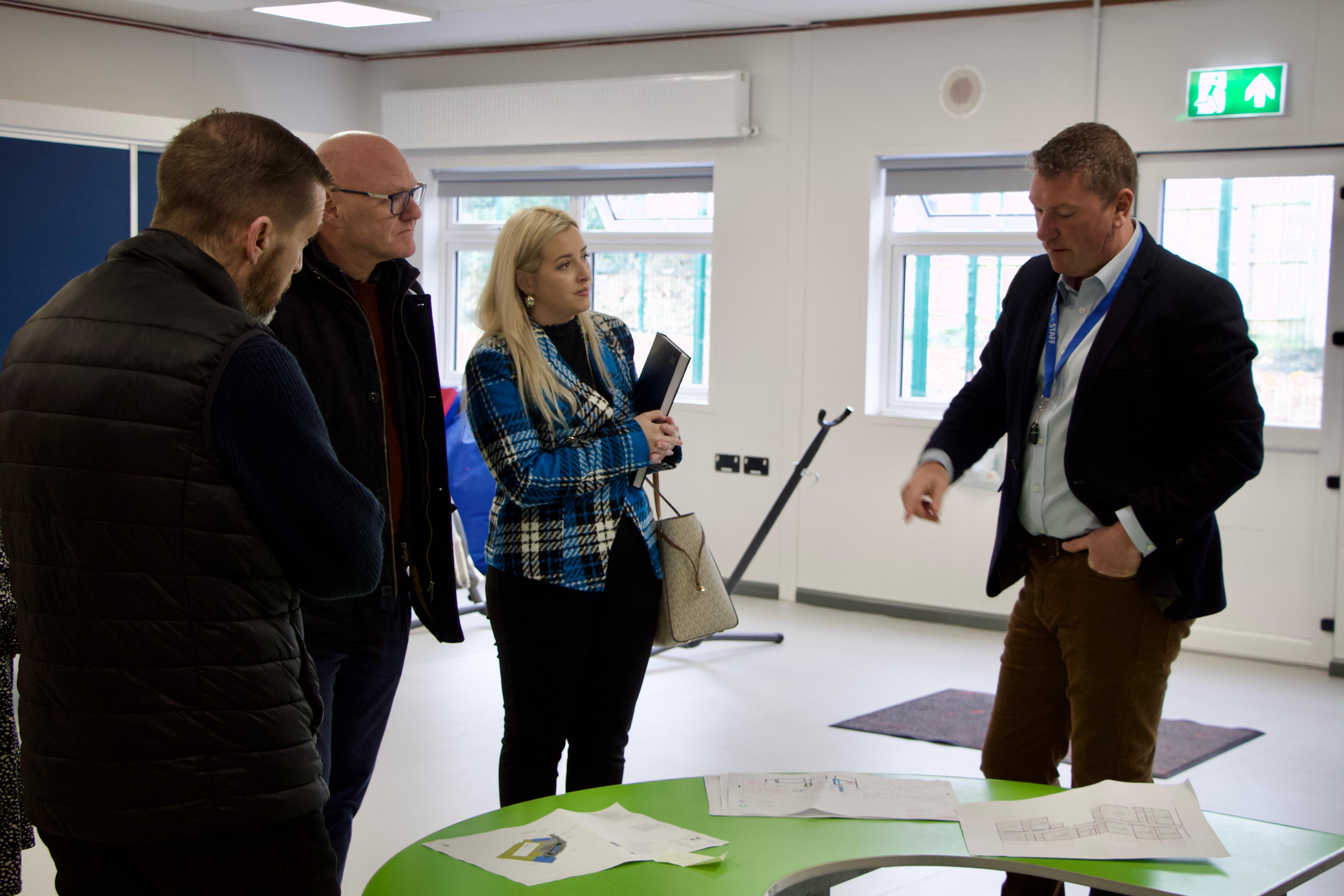 VISIT: St Gerard’s Principal Stephen Ramsay, right, with Órlaithí Flynn MLA, Paul Maskey MP and Cllr Matt Garrett