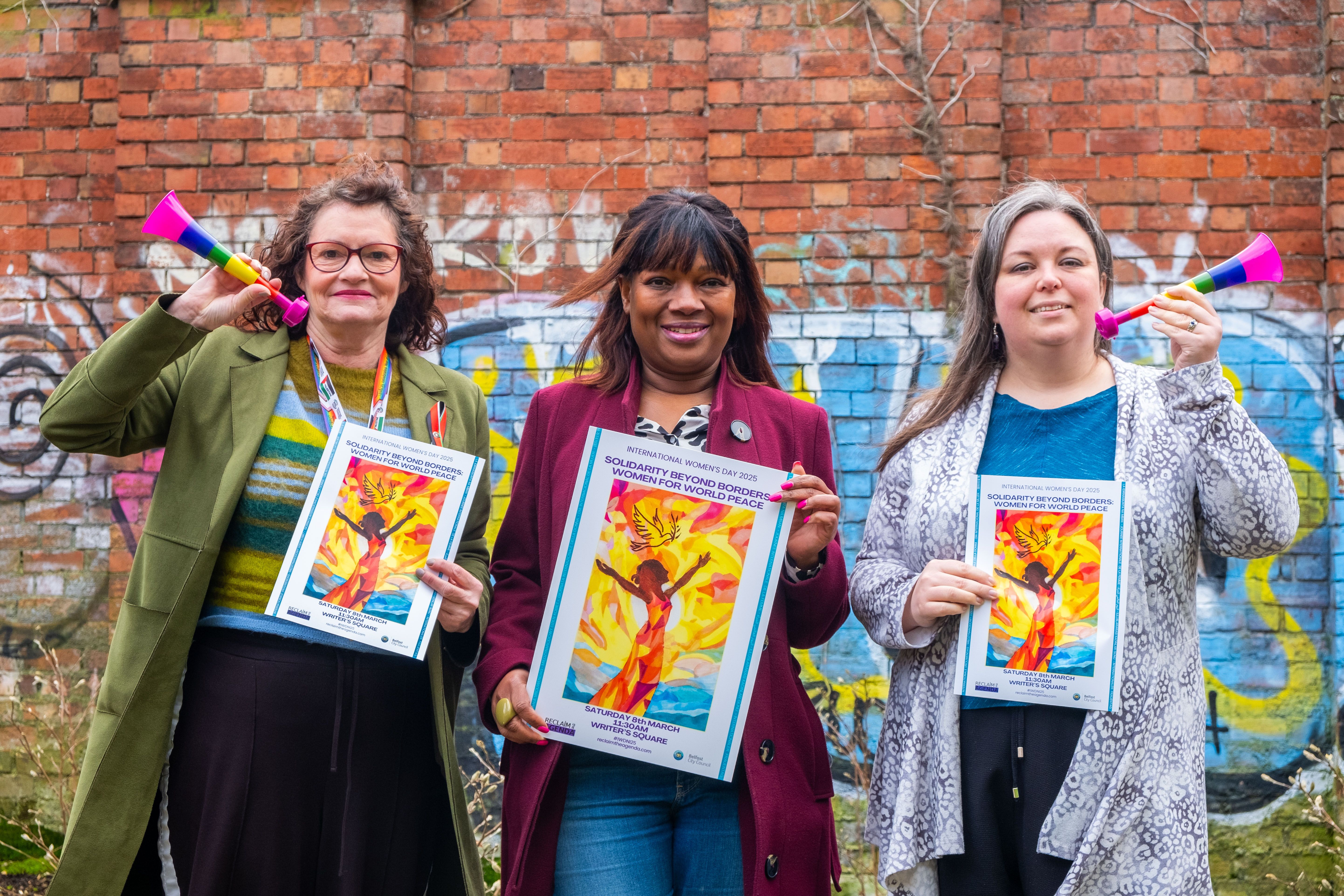 TOGETHER: March organisers Helen Crickard and Danielle Roberts from Reclaim the Agenda and rally host Sipho Sabanda (centre)