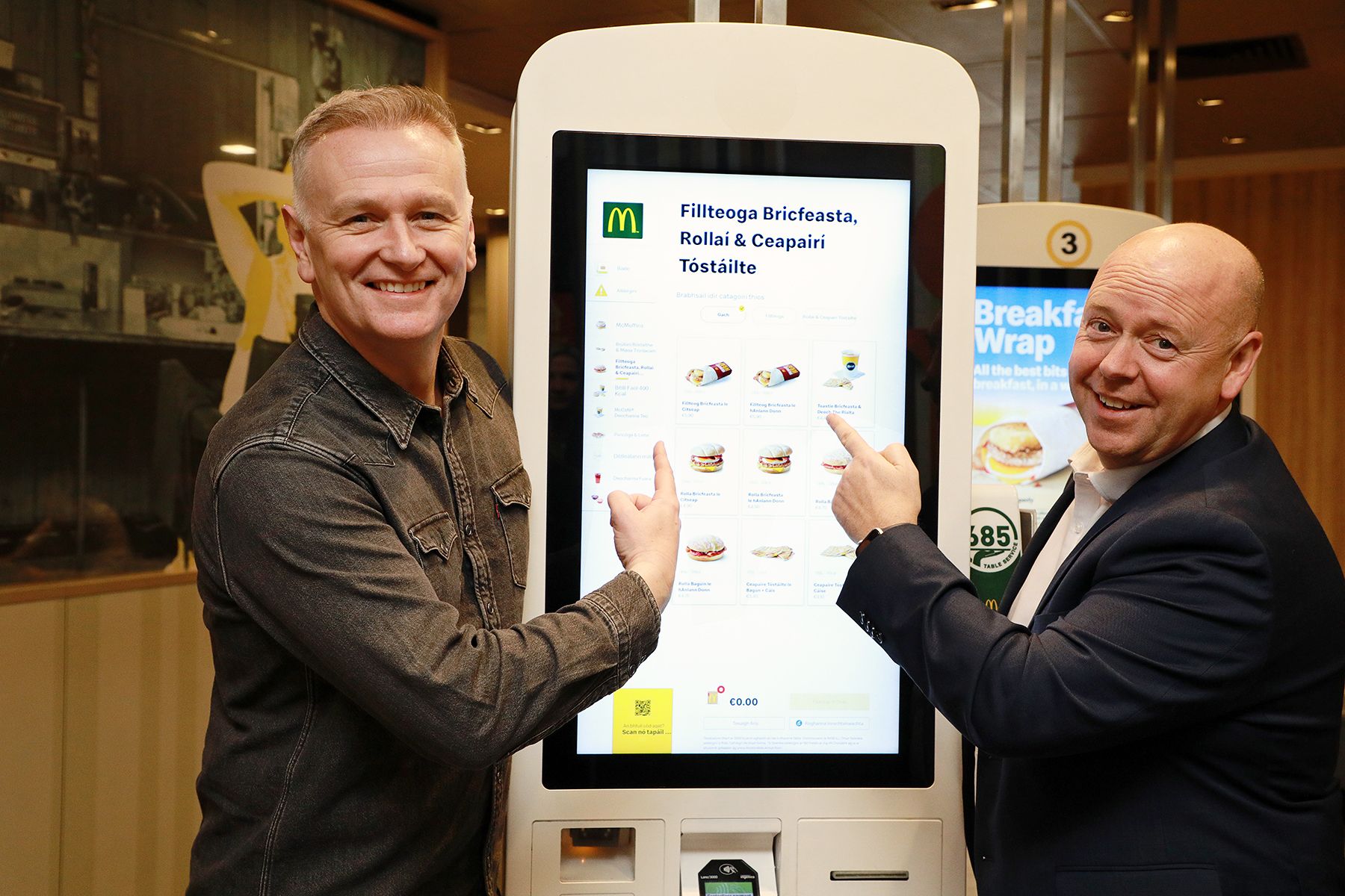 FÁILTE: Irish television presenter Dáithí Ó Sé (L) and franchisee of McDonald’s Westside Shopping Centre in Galway Aaron Byrne (R) at the launch of the Irish Language Kiosks on Shop Street in Galway