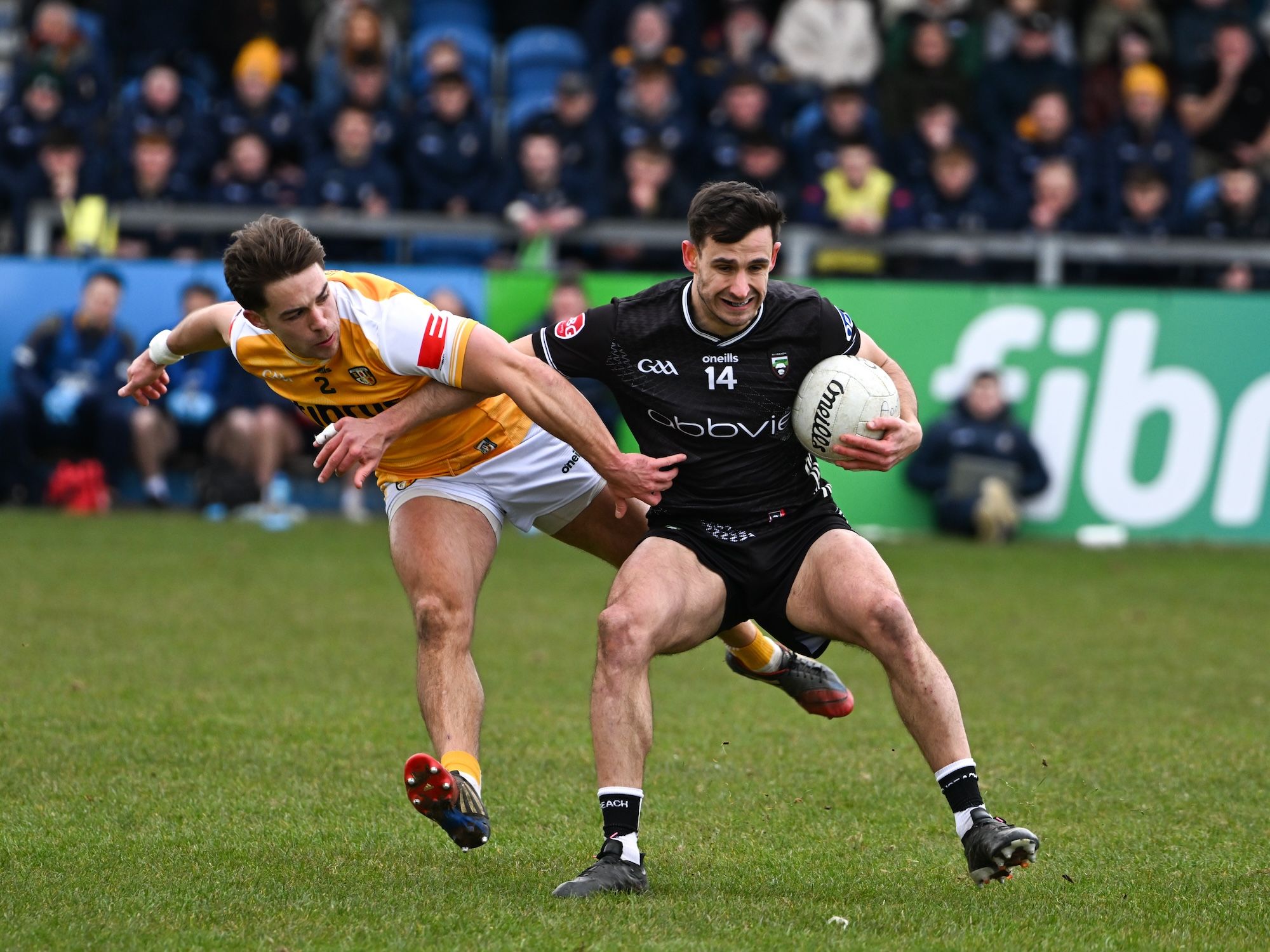 Sligo\'s Niall Murphy holds off the challenge of Eoghan McCabe 