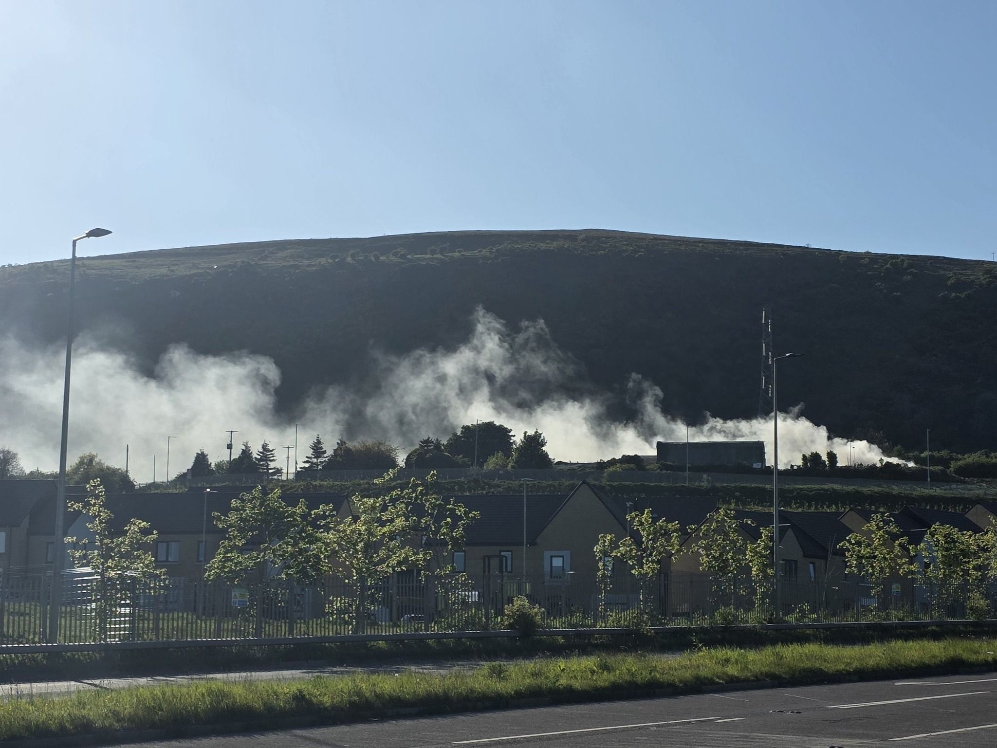 DANGER: Smoke hovers over the Upper Springfield on Monday evening
