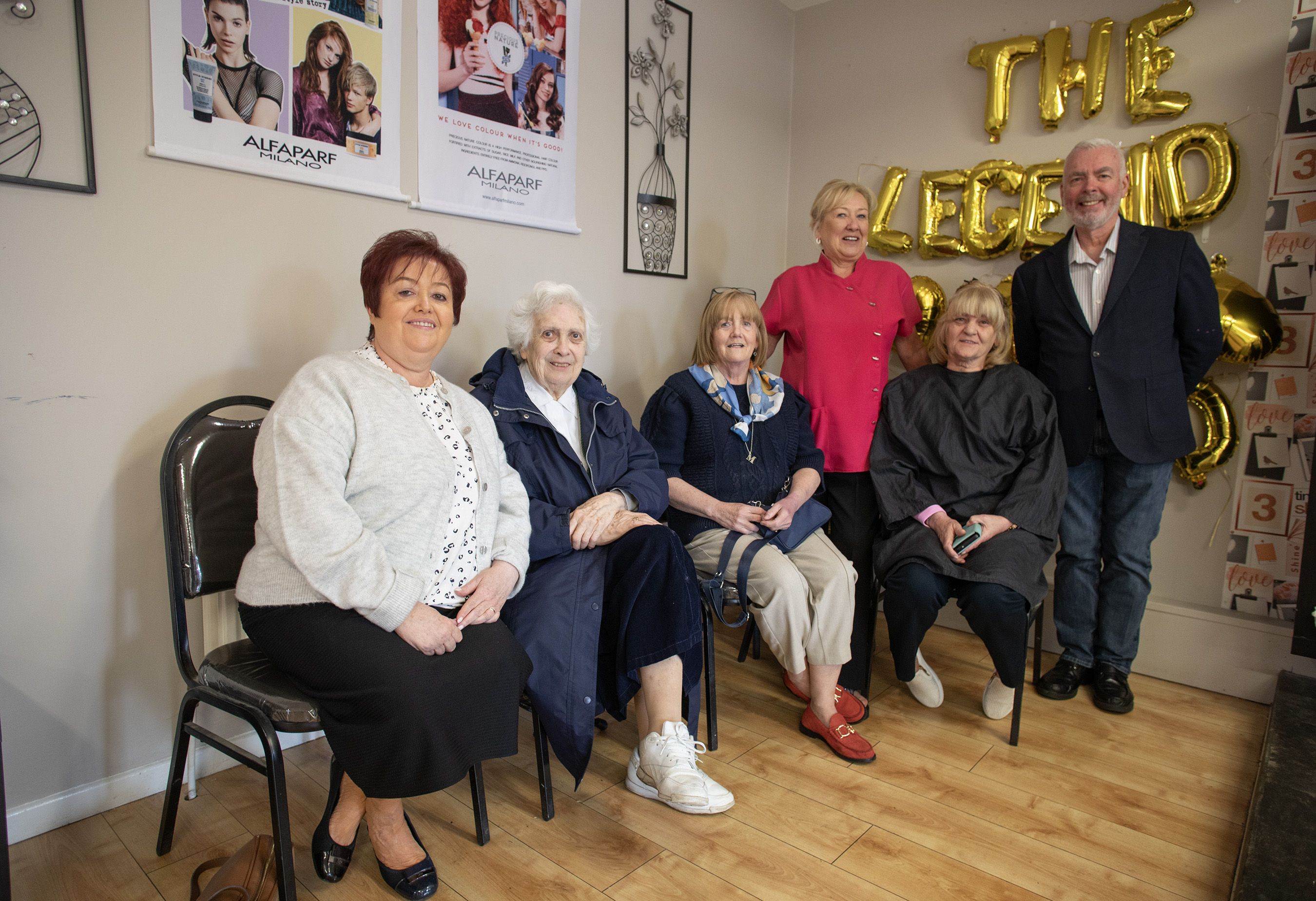 THE LEGEND: Isobell (standing) with Dermot Kennedy and some of her customers