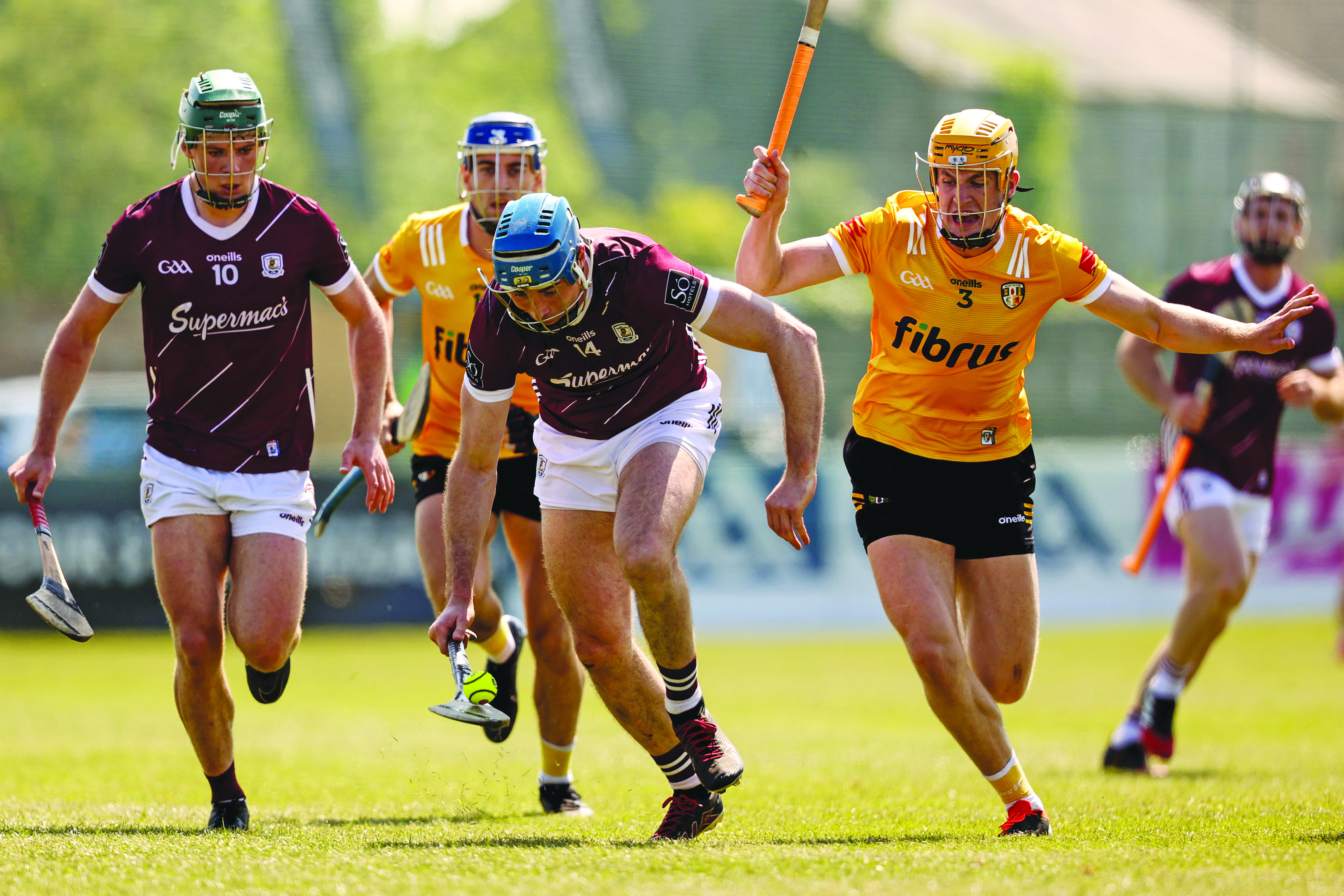 Conor Cooney gets a step on Niall O’Connor during Galway’s win over Antrim in Belfast last year