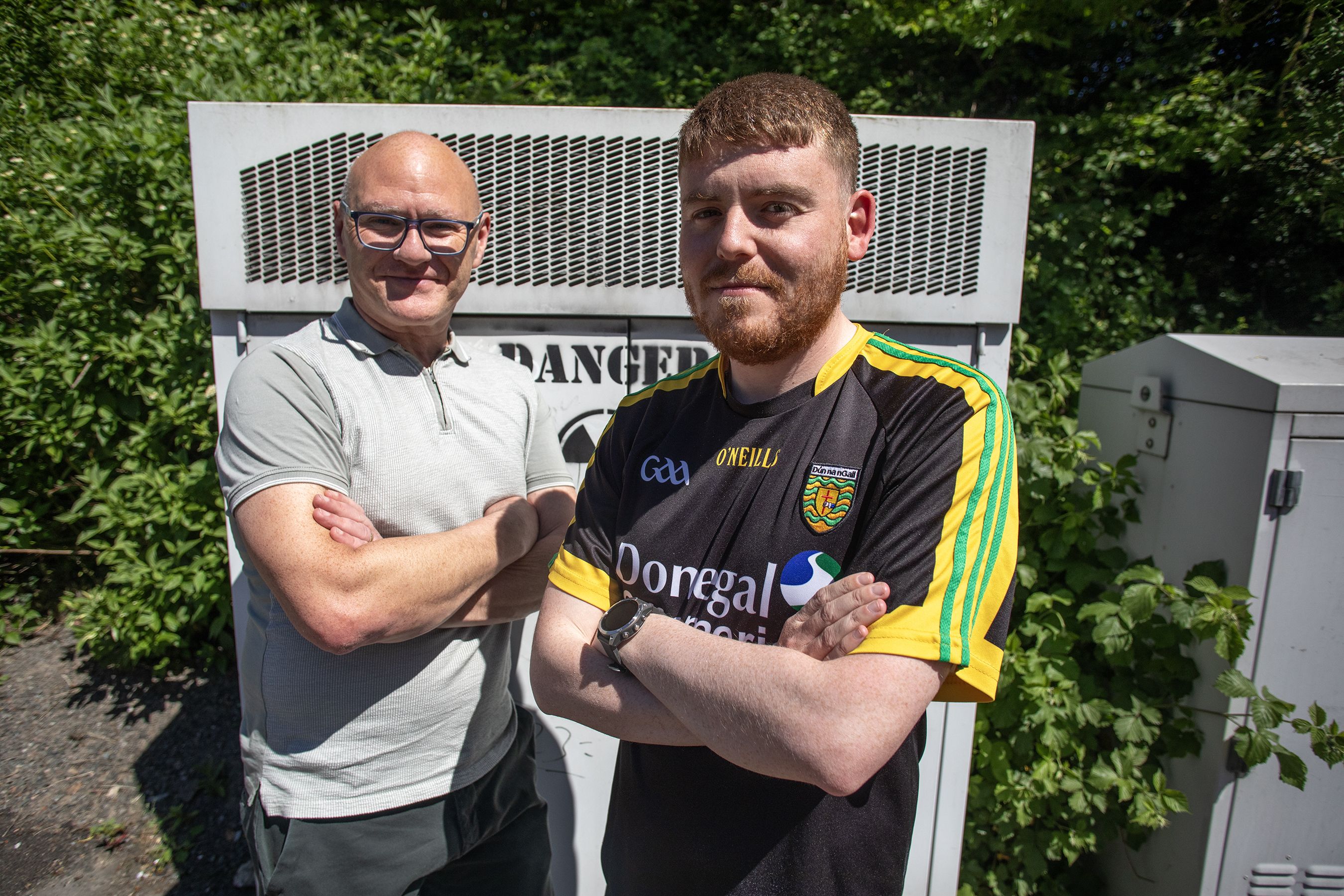 CONCERN: West Belfast MP Paul Maskey and Cllr Ronan McLaughlin at a previously damaged phone mast on the Monagh Bypass