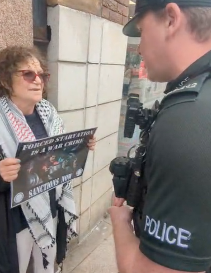 OUTRAGE: Sue Pentel being arrested this morning in Belfast