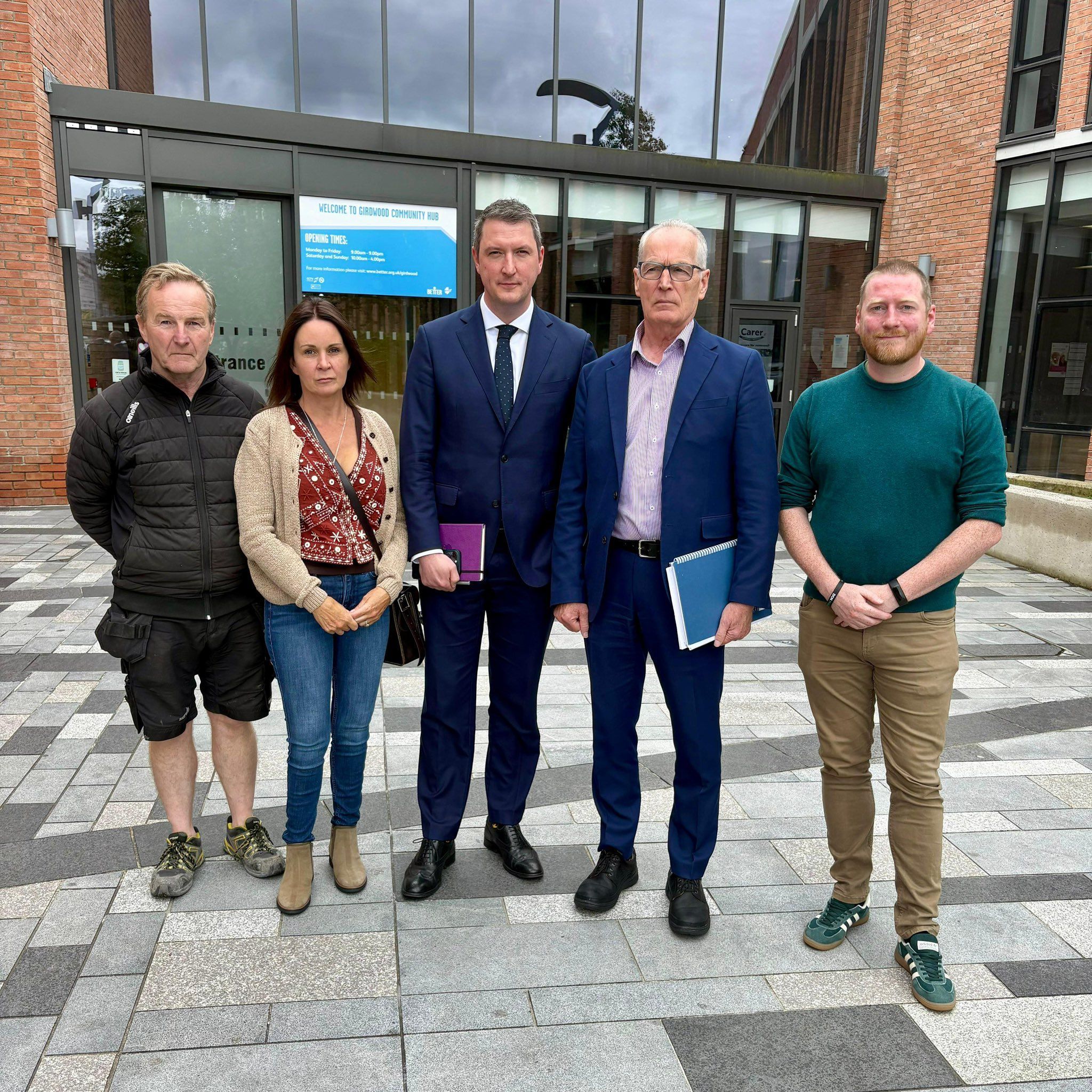 MEETING: Sinn Féin representatives Cllr JJ Magee, Cllr Nichola Bradley, John Finucane MP, Gerry Kelly MLA and Cllr Tómas Ó Neill outside Girdwood Community Hub on Tuesday