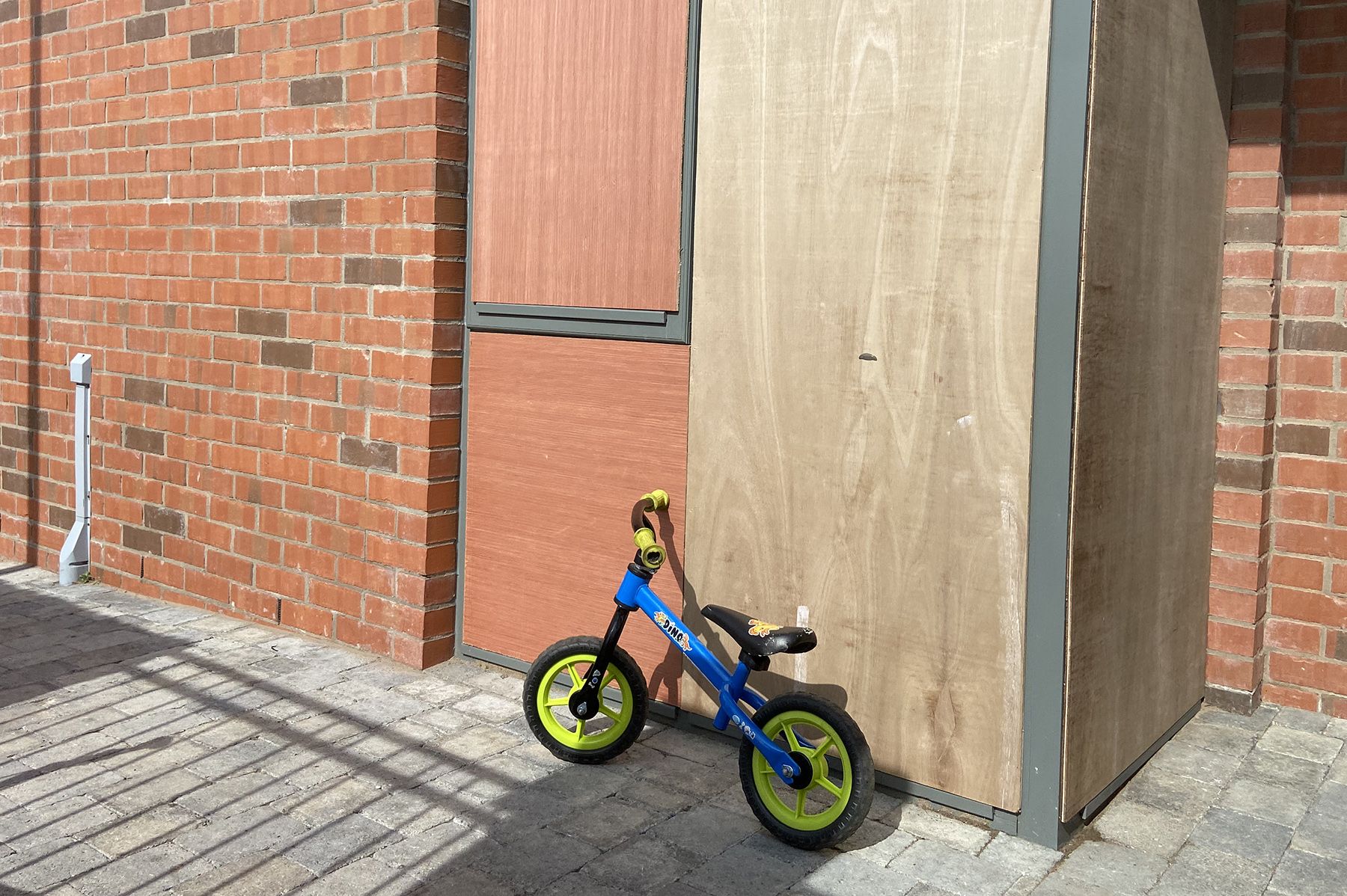 STEPPING BACK IN TIME: A child\'s toy sits outside a house with boarded up windows in Annalee Street