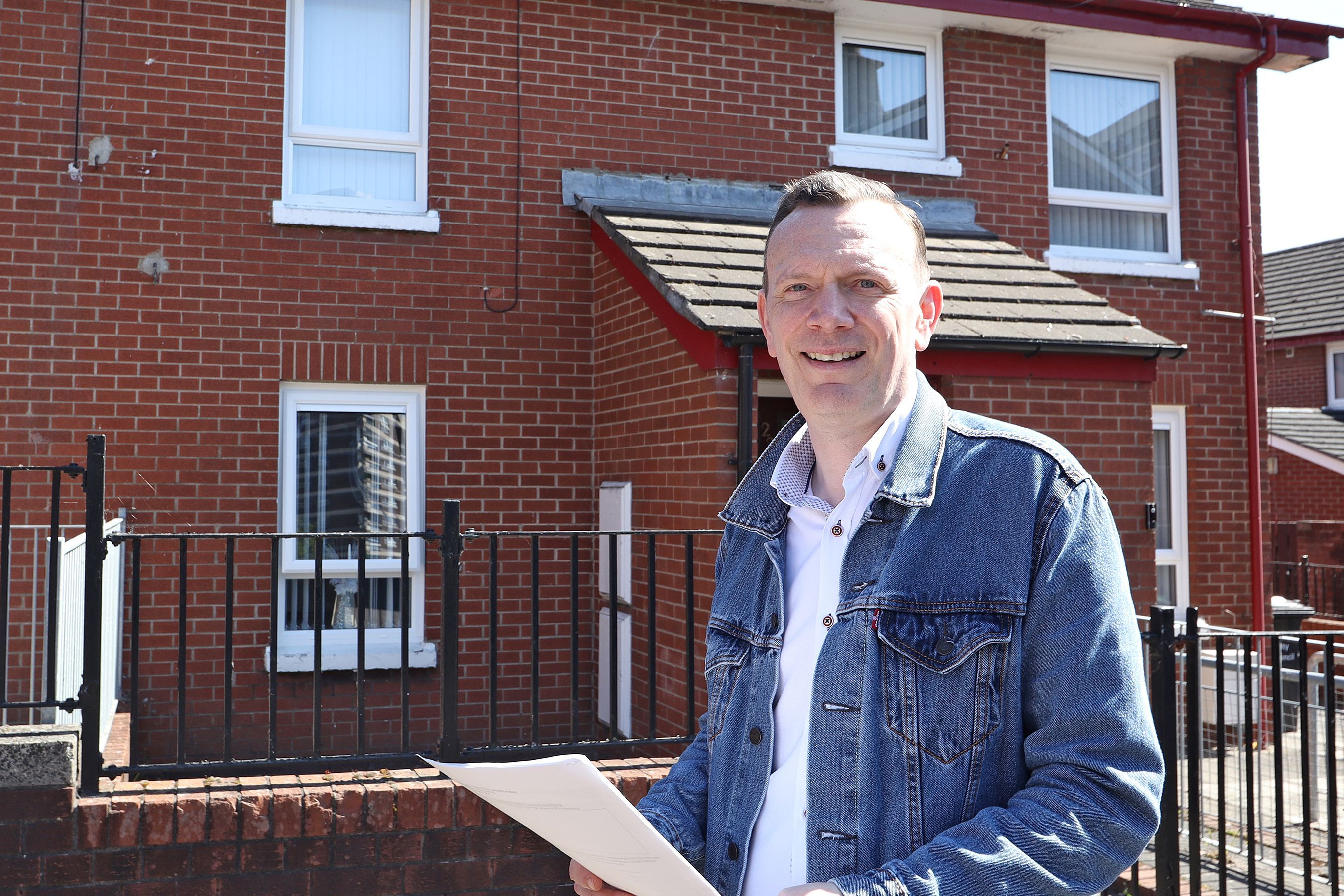 UPGRADE: Housing Executive Patch Manager John Rafferty inspects the new windows installed as part of a £600,000 investment in the New Lodge