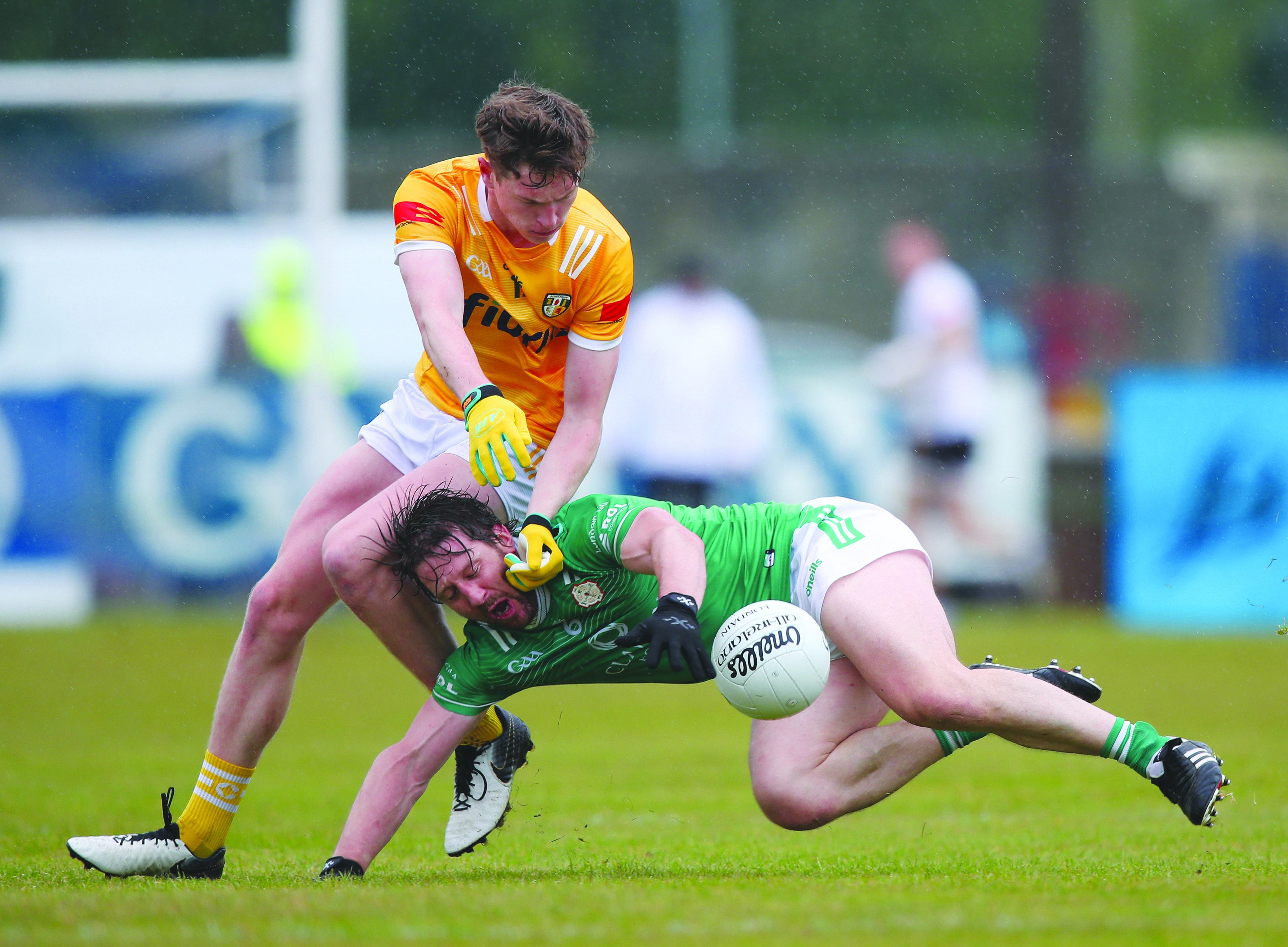 Conor Hand challenges Cahir Healy during Antrim’s win over London last year