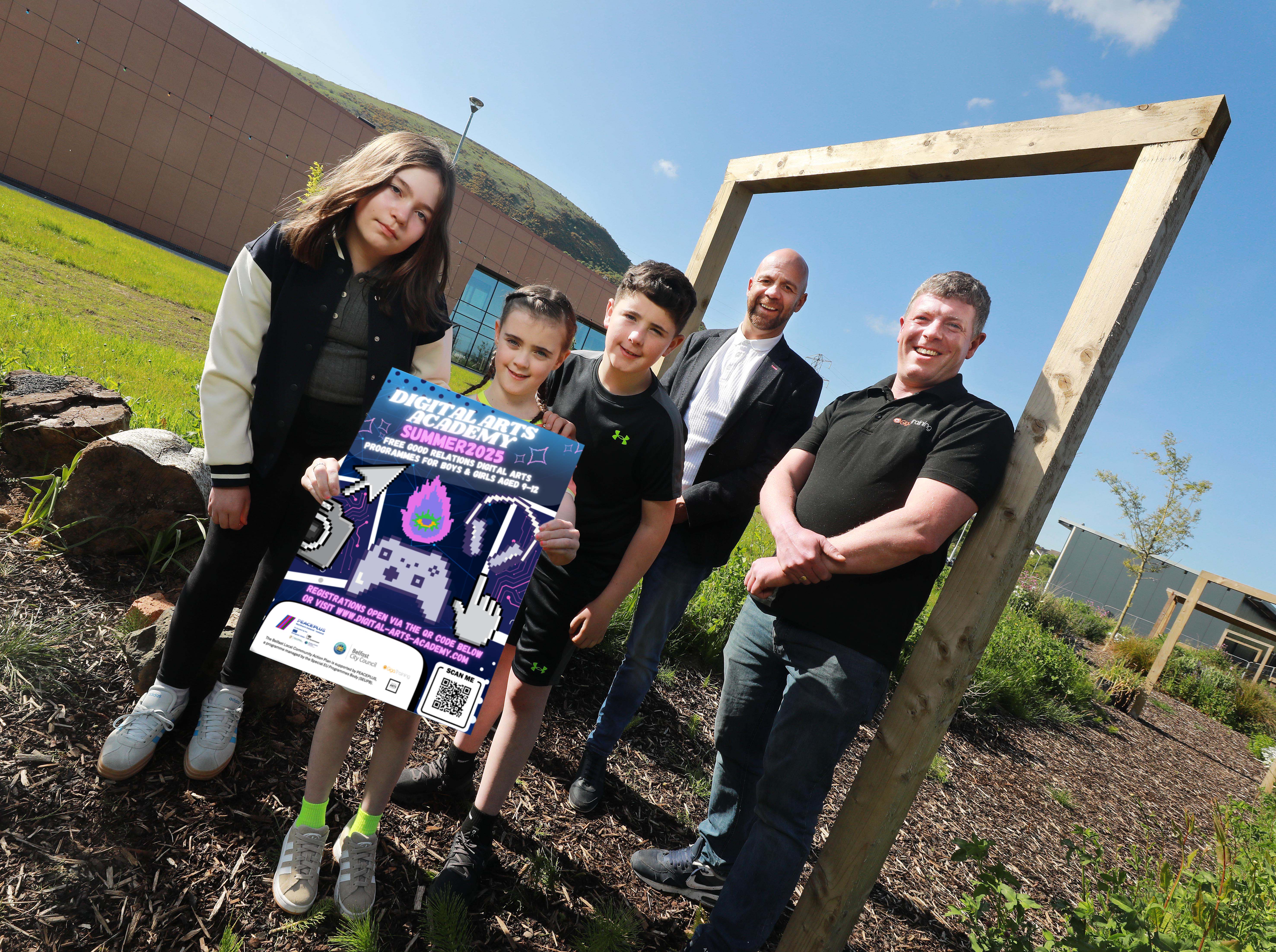 SUMMER FUN: Summer scheme participants Christopher, Erin and Cainah with Councillor Joe Duffy, Chair of Belfast City Council’s Shared City Partnership, and John Walls from Digital Arts Academy
