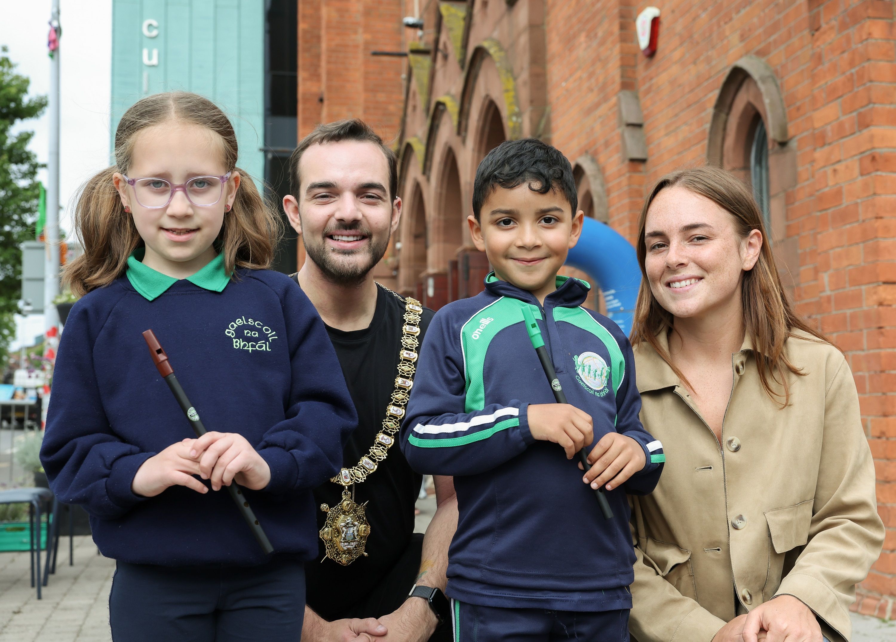 MAITH SIBH: Éimear Nic Ionnrachtaigh (Fís an Phobail) with Gaelscoil na bhFál pupils Aoife Doyle and Seán O’Connor and Lord Mayor of Belfast, Councillor Micky Murray