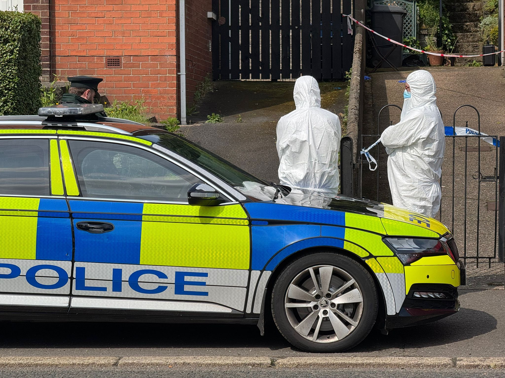 SUDDEN DEATH: Police at the scene on the Shore Road on Tuesday morning