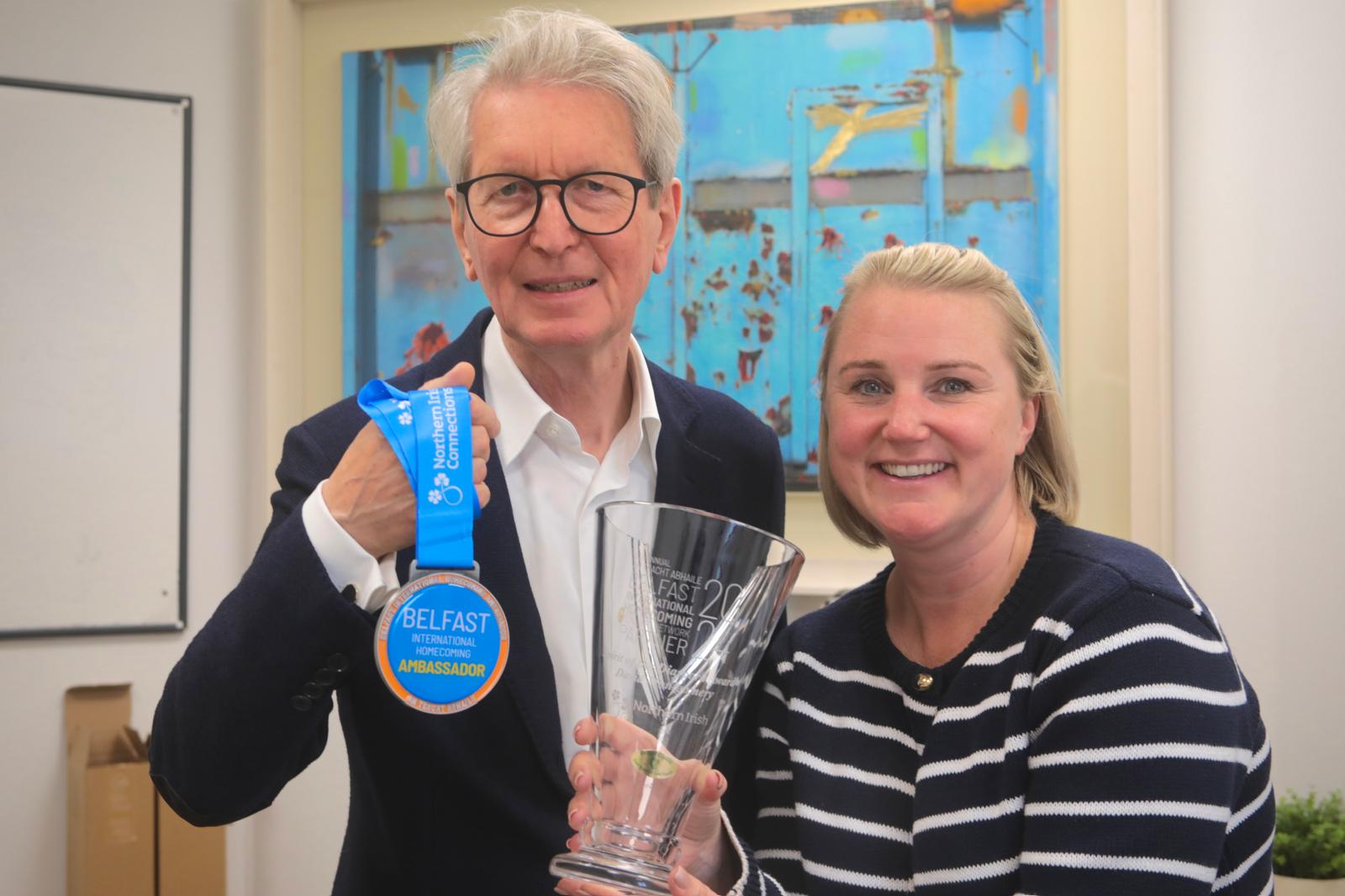 THE ONE THAT (ALMOST) GOT AWAY: David Montgomery receives his award and Belfast Ambassaor Medal from Homecoming host Connla McCann of Aisling Events