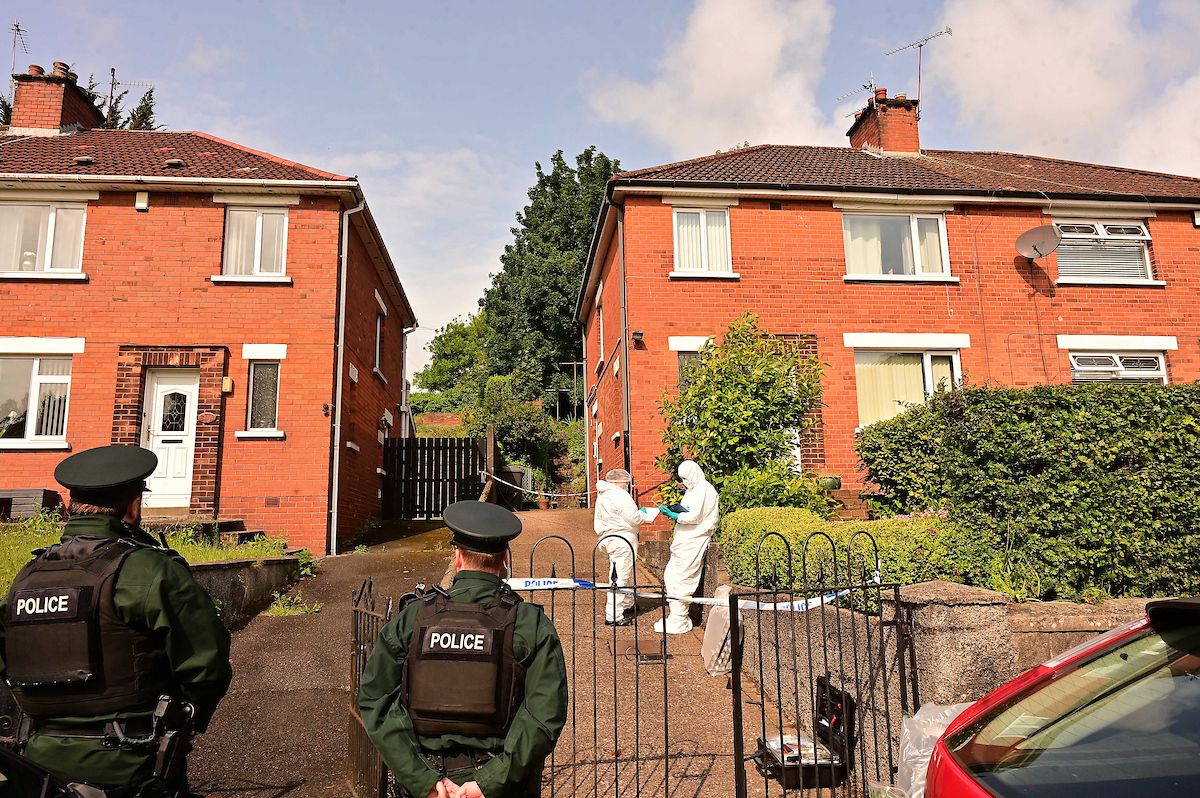 MURDER INVESTIGATION: The scene at the house on the Shore Road on Tuesday