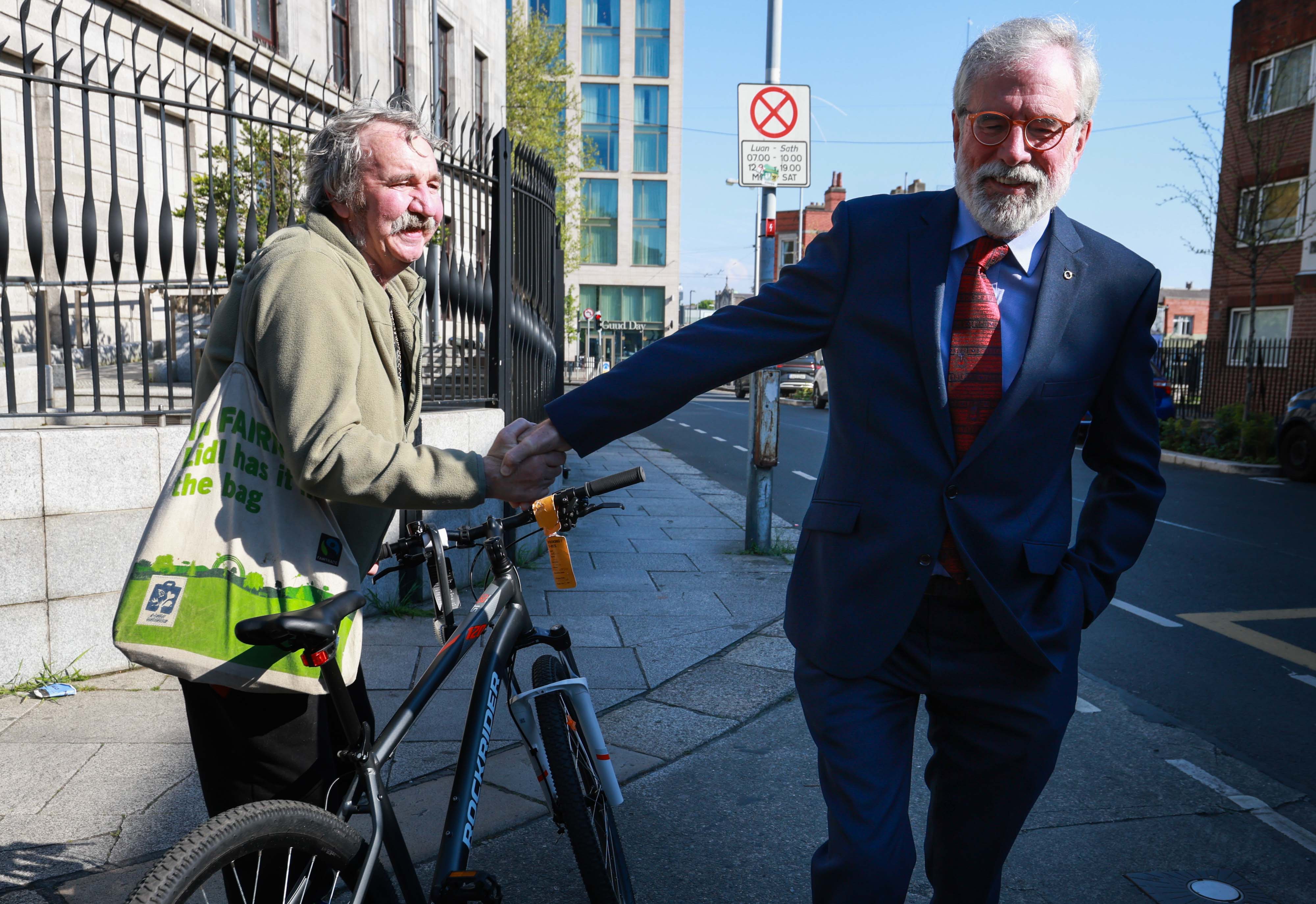 SUCCESS: A well-wisher greets Gerry Adams after his Four Courts win against BBCNI
