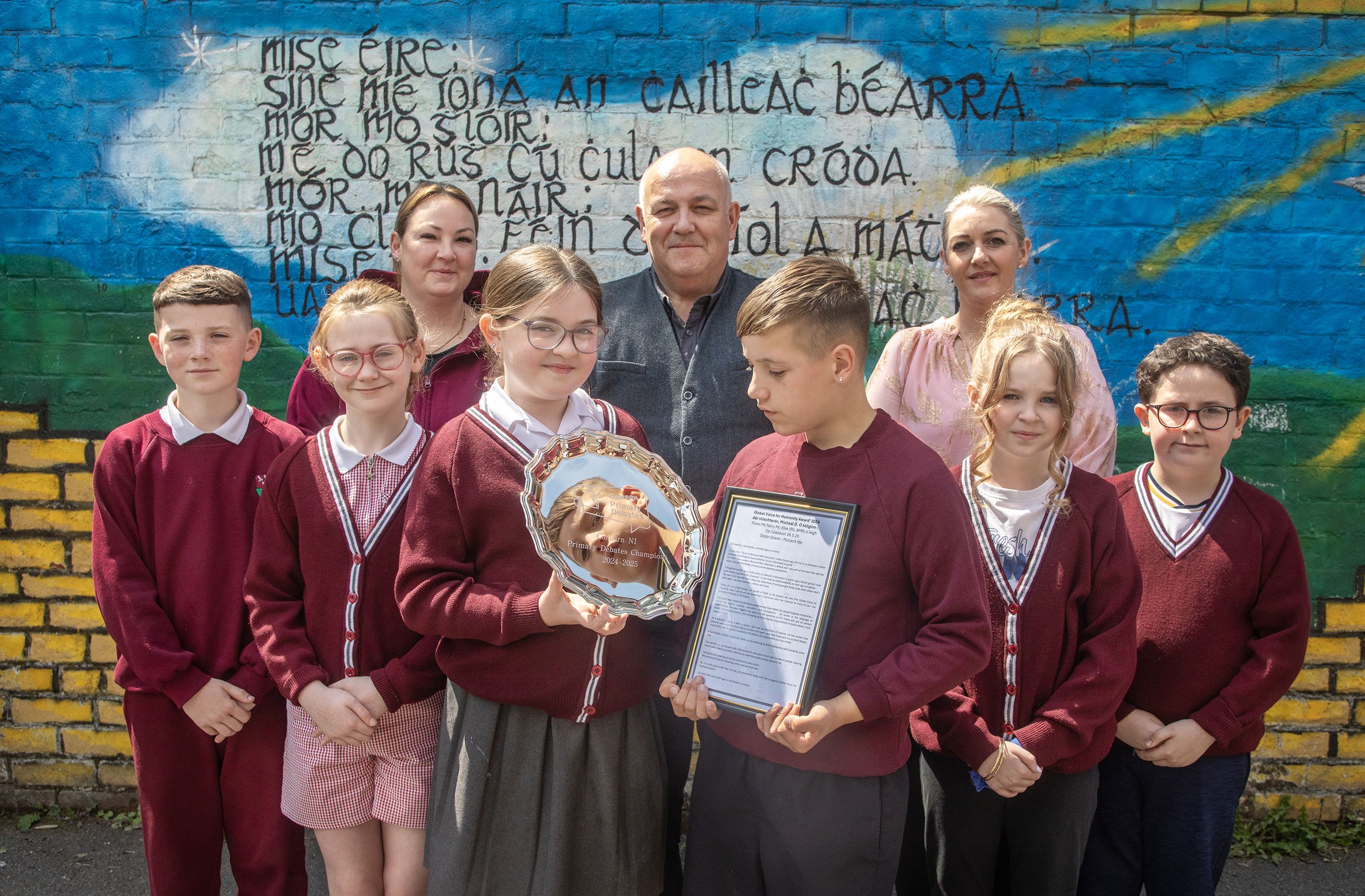 AWARD: Pupils and staff from Bunscoil Mhic Reachtain with their award