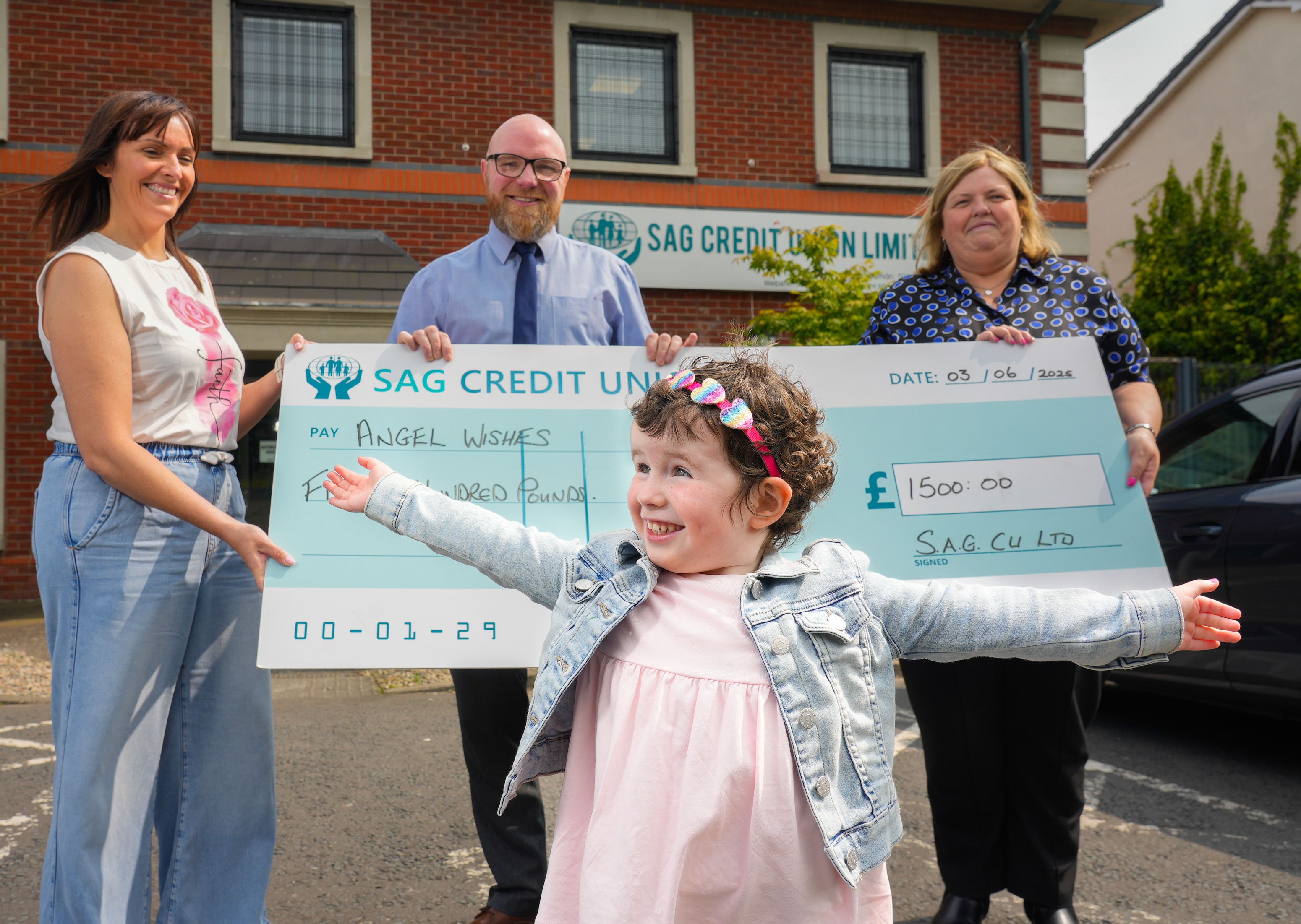 SUPPORT: SAG Credit Union staff members, Seamus and Shona present Erin and her mum Marie with a cheque for Angel Wishes charity