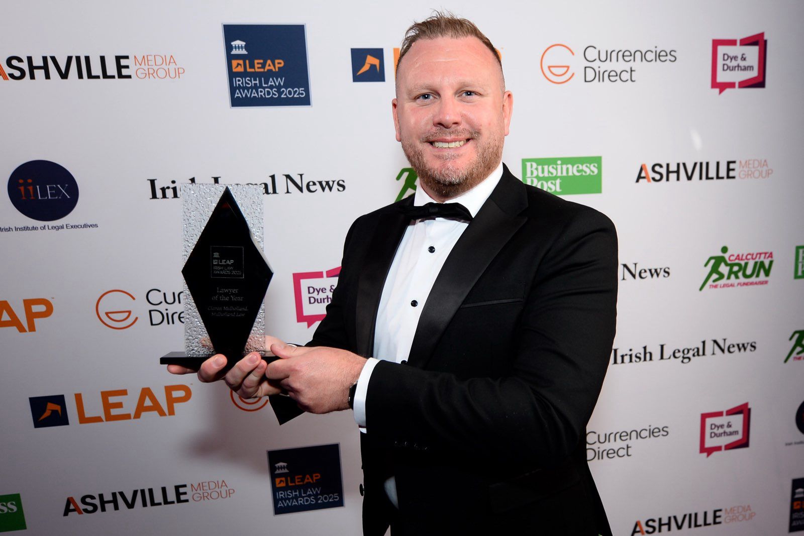 DESERVED: Ciarán Mulholland celebrates with his award on Friday night