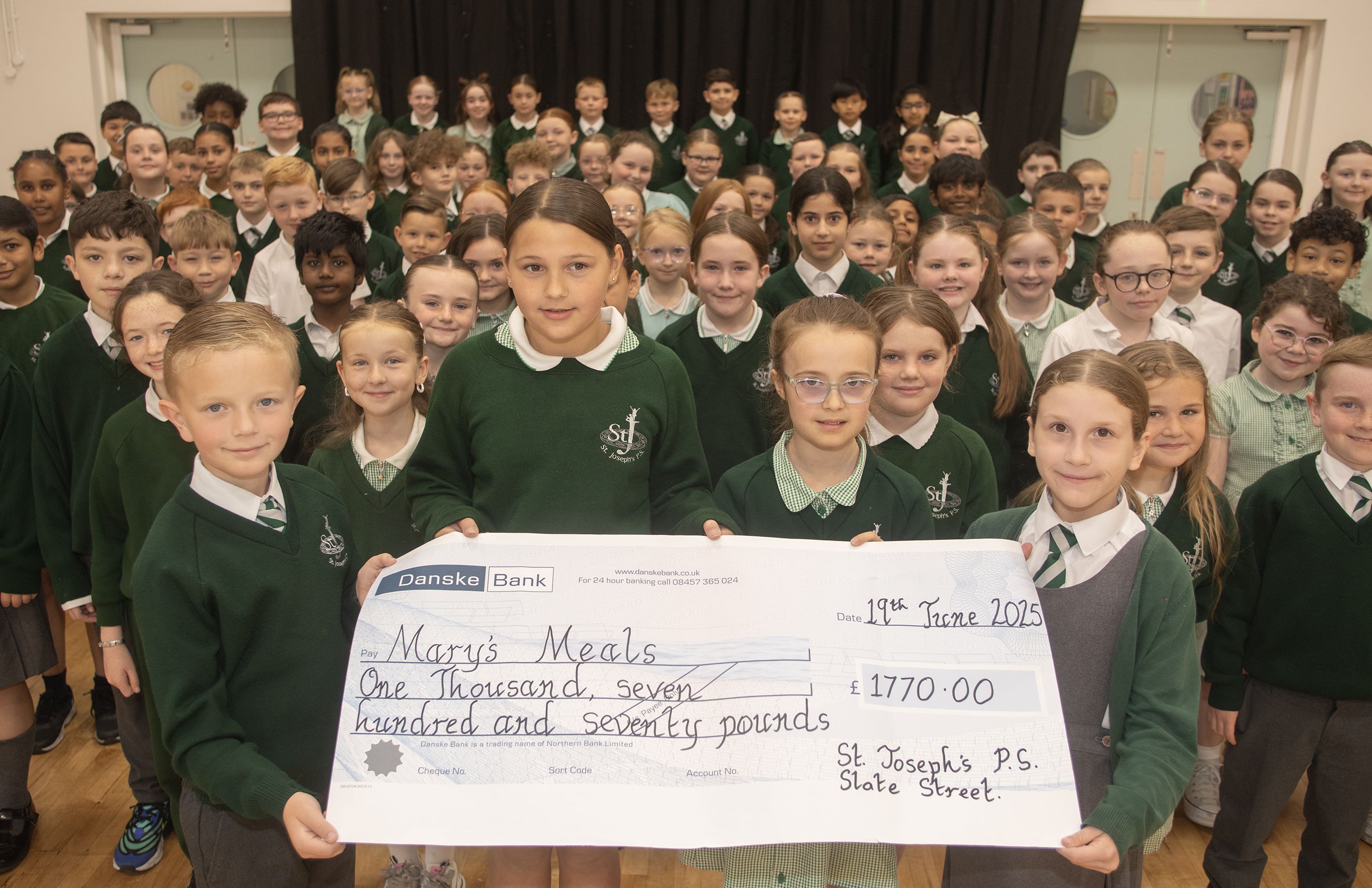 DONATION: Pupils from St Joseph\'s PS with a cheque for Mary\'s Meals