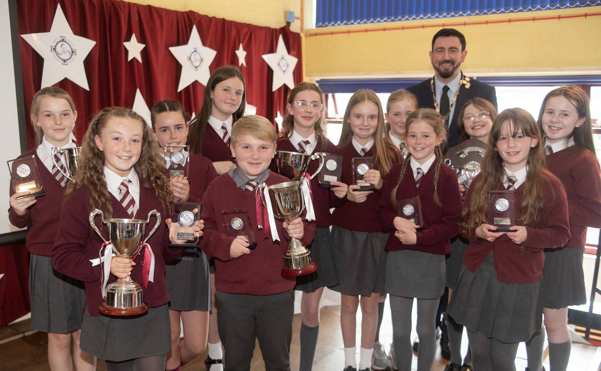 SUCCESS: Deputy Lord Mayor Paul Doherty with the young pupils and their awards