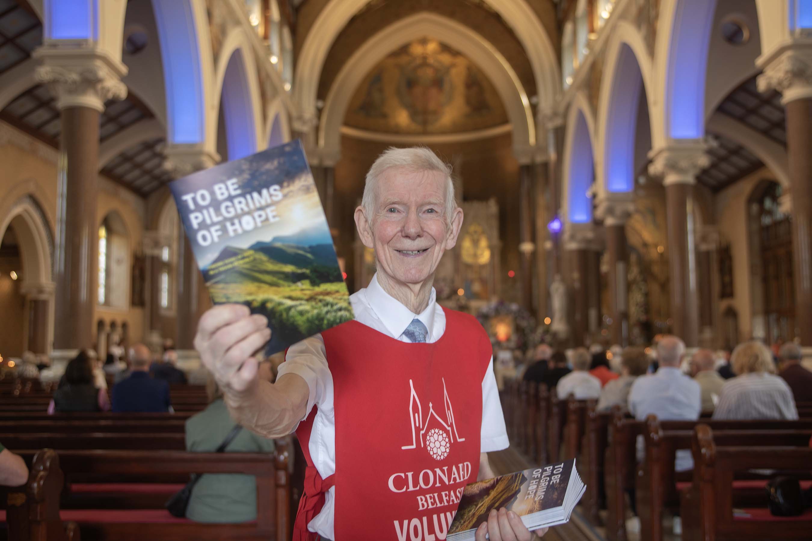 FÁILTE: Dessie McDonnell hands out Mass leaflets as people arrive at Clonard on Wednesday morning