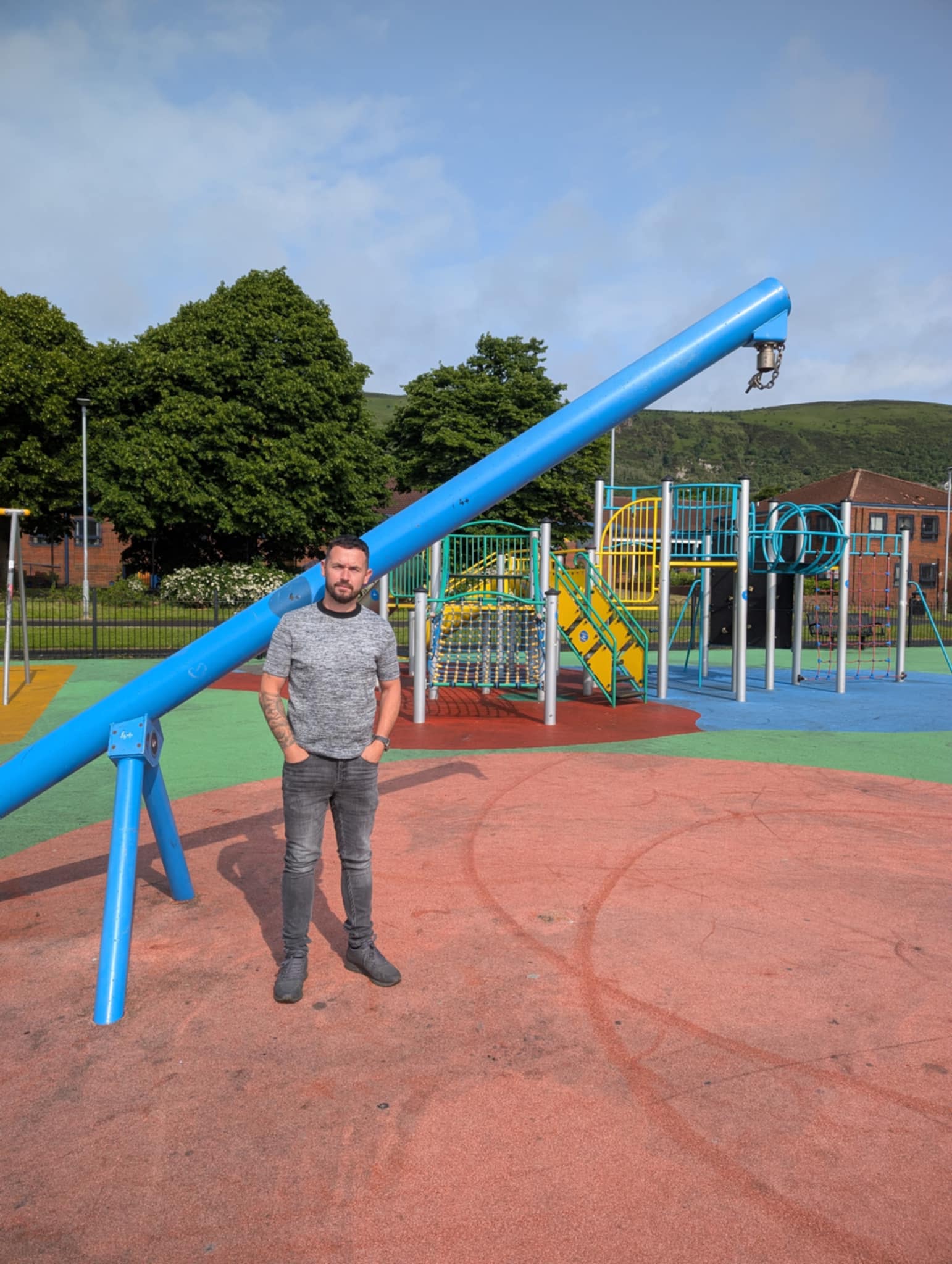 SENSELESS: Cllr Donnelly at a damaged swing