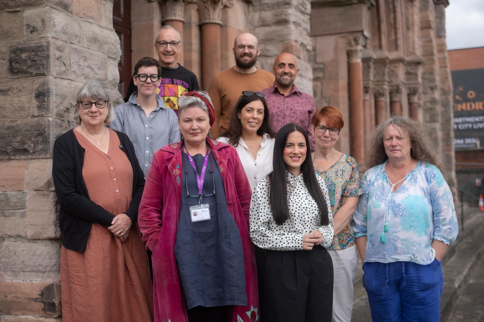 VISION FOR FUTURE: Participants in the day-long conference on the peacewalls pictured outside Townsend Presbyterian Church on the peaceline - now home to the Ulster Orchestra. Vicky Cosstick is on the far left.