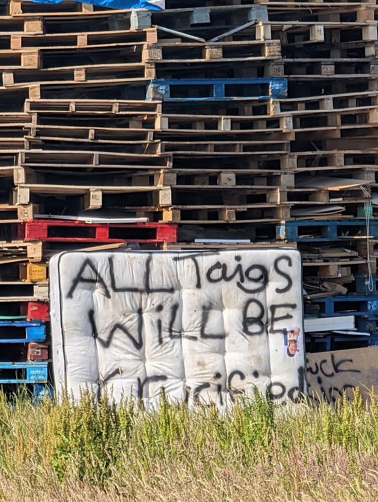 FAMILIAR: A threat to Catholics scrawled on a bonfire in the Ballybeen estate