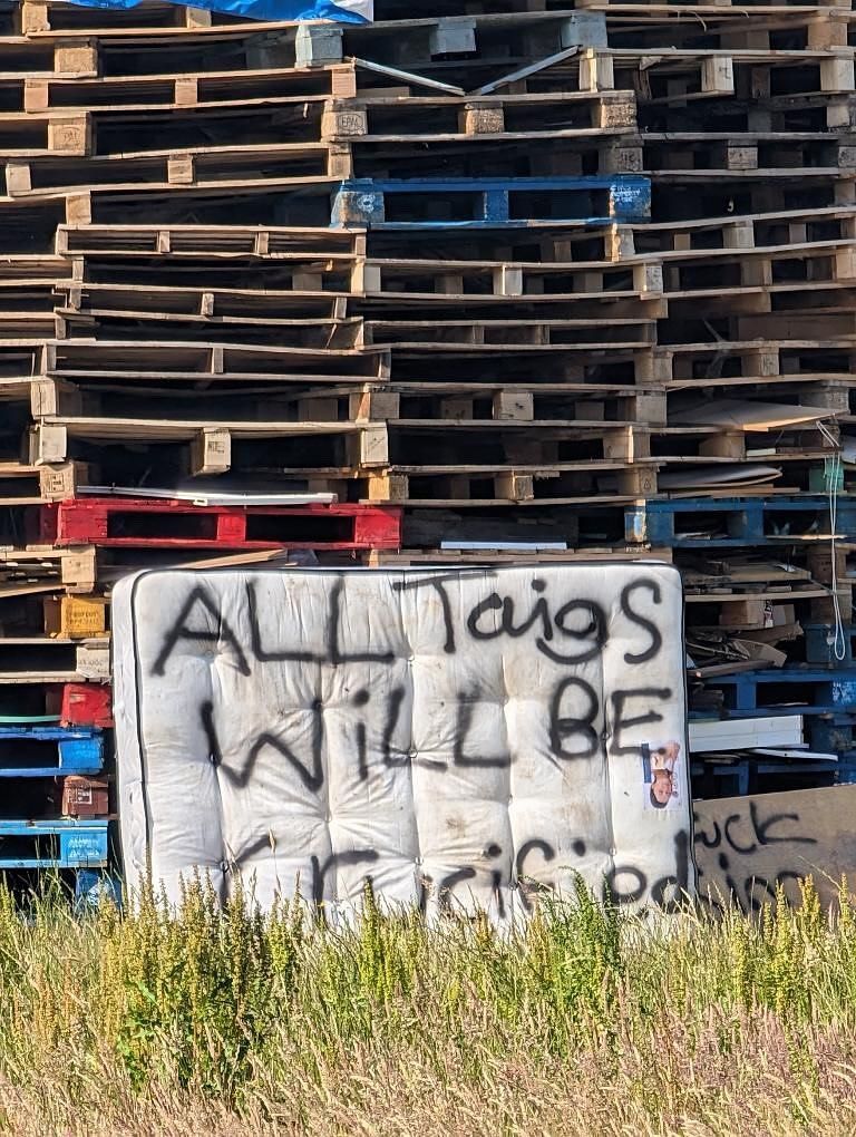 FAMILIAR: A threat to Catholics scrawled on a bonfire in the Ballybeen estate