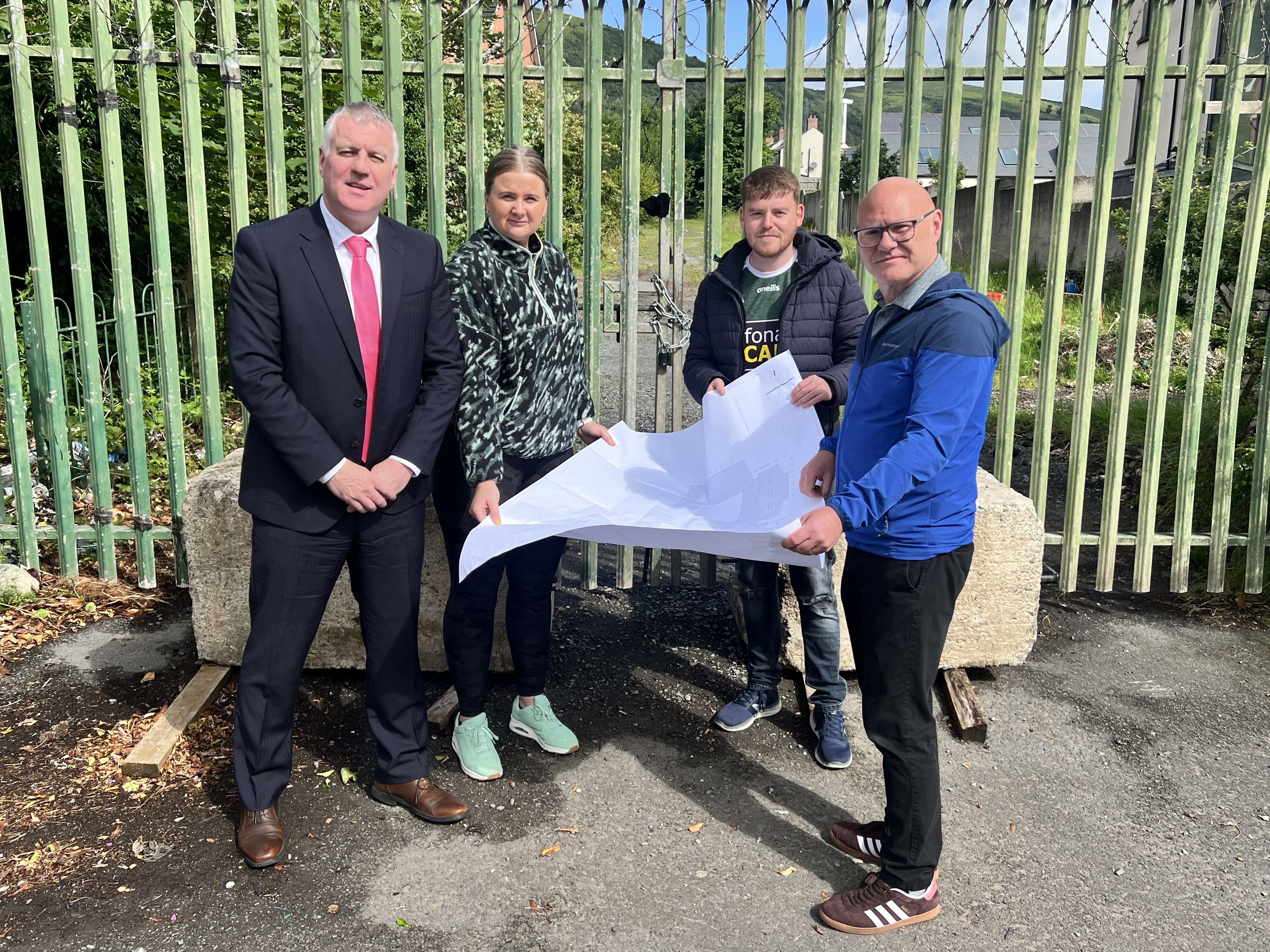 PROGRESS: All Saints College Principal Damien Coyle with Aisling Reilly MLA, Councillor Ronan McLaughlin and Paul Maskey MP