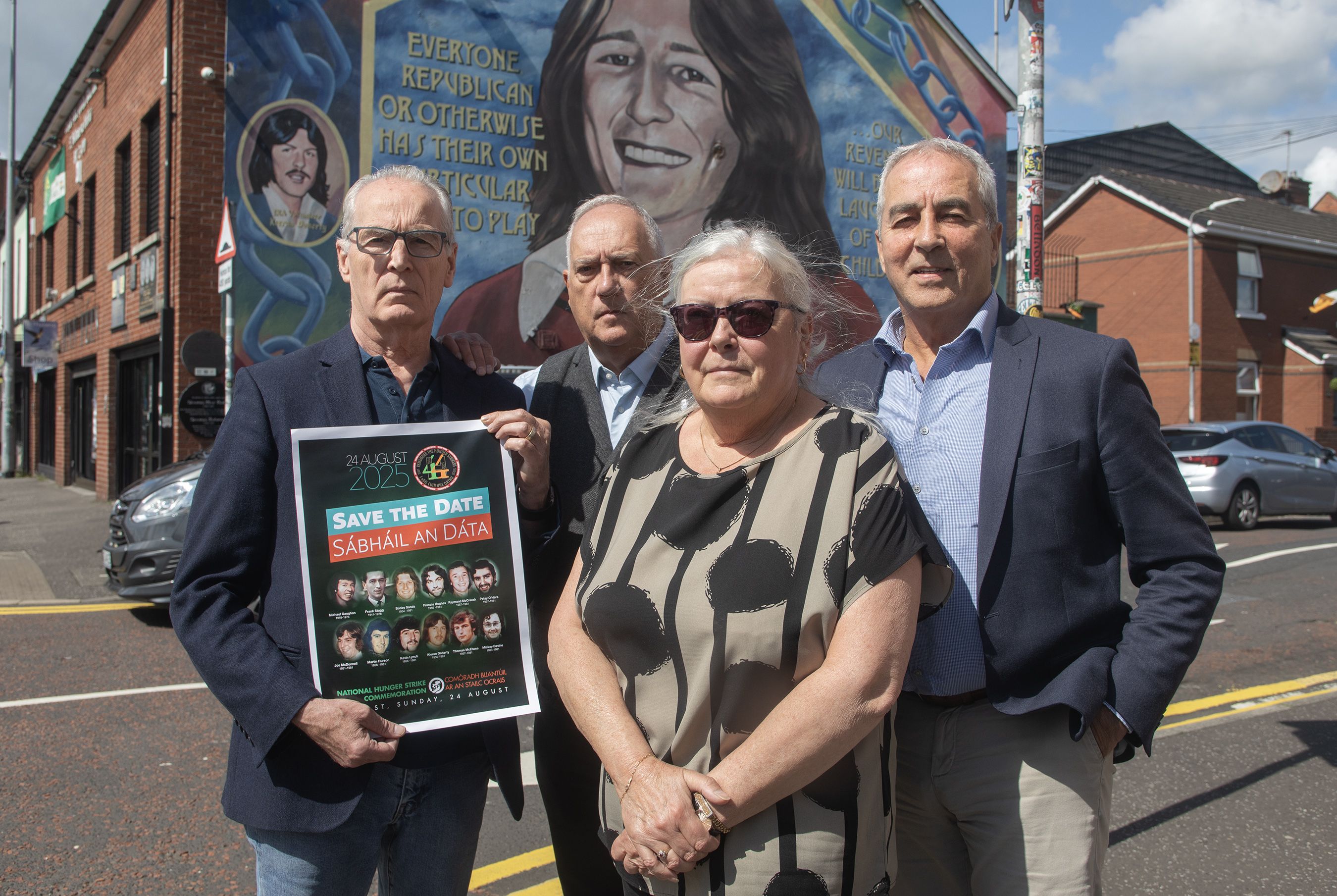 LE CHÉILE: Sinn Féin MLAs Gerry Kelly and Pat Sheehan, Cllr Séanna Walsh and Síle Darragh at the Bobby Sands mural on the Falls Road this morning