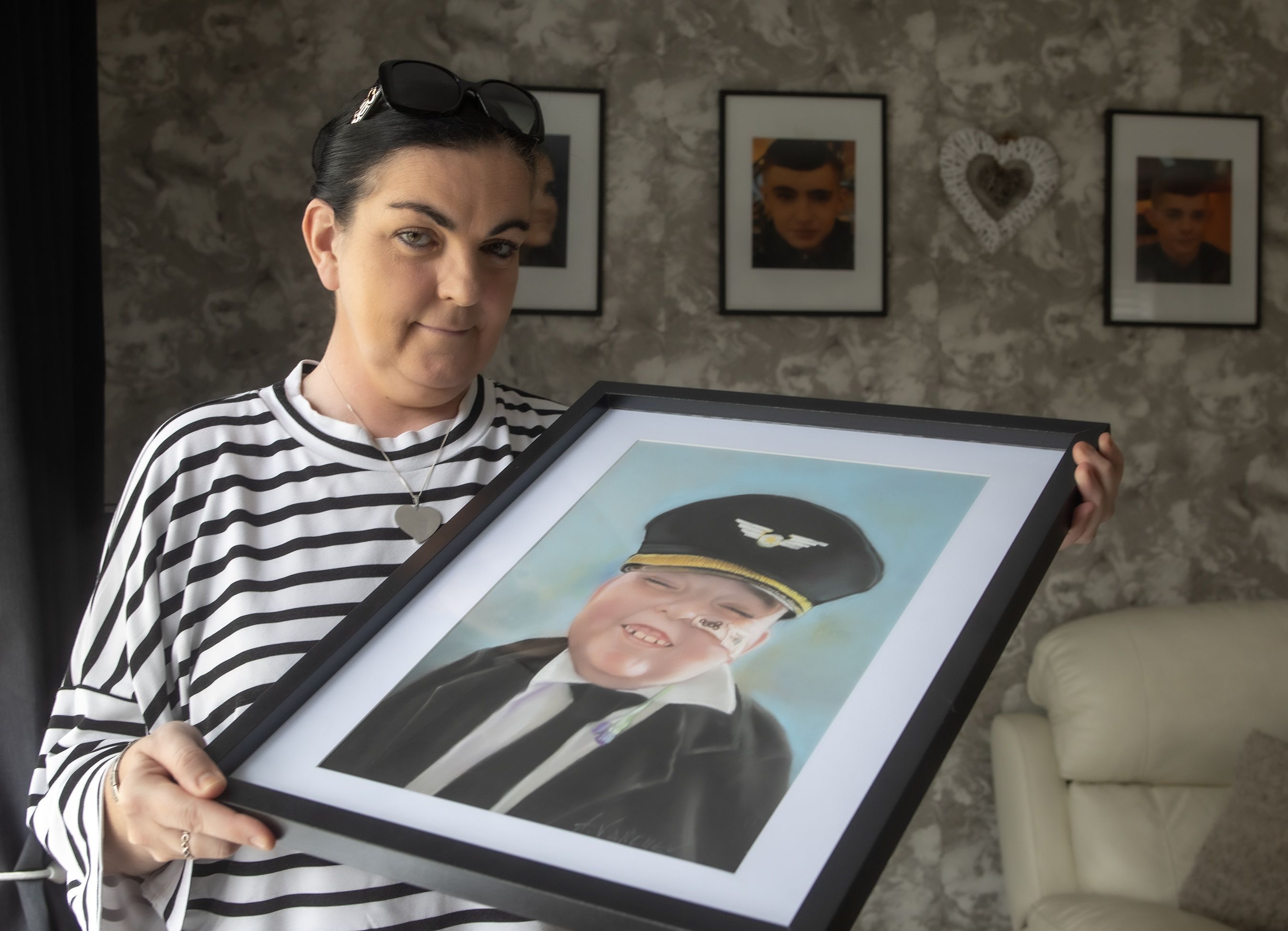 REMEMBERED: Caitriona Adams with a framed photo of her late son Caoimhín