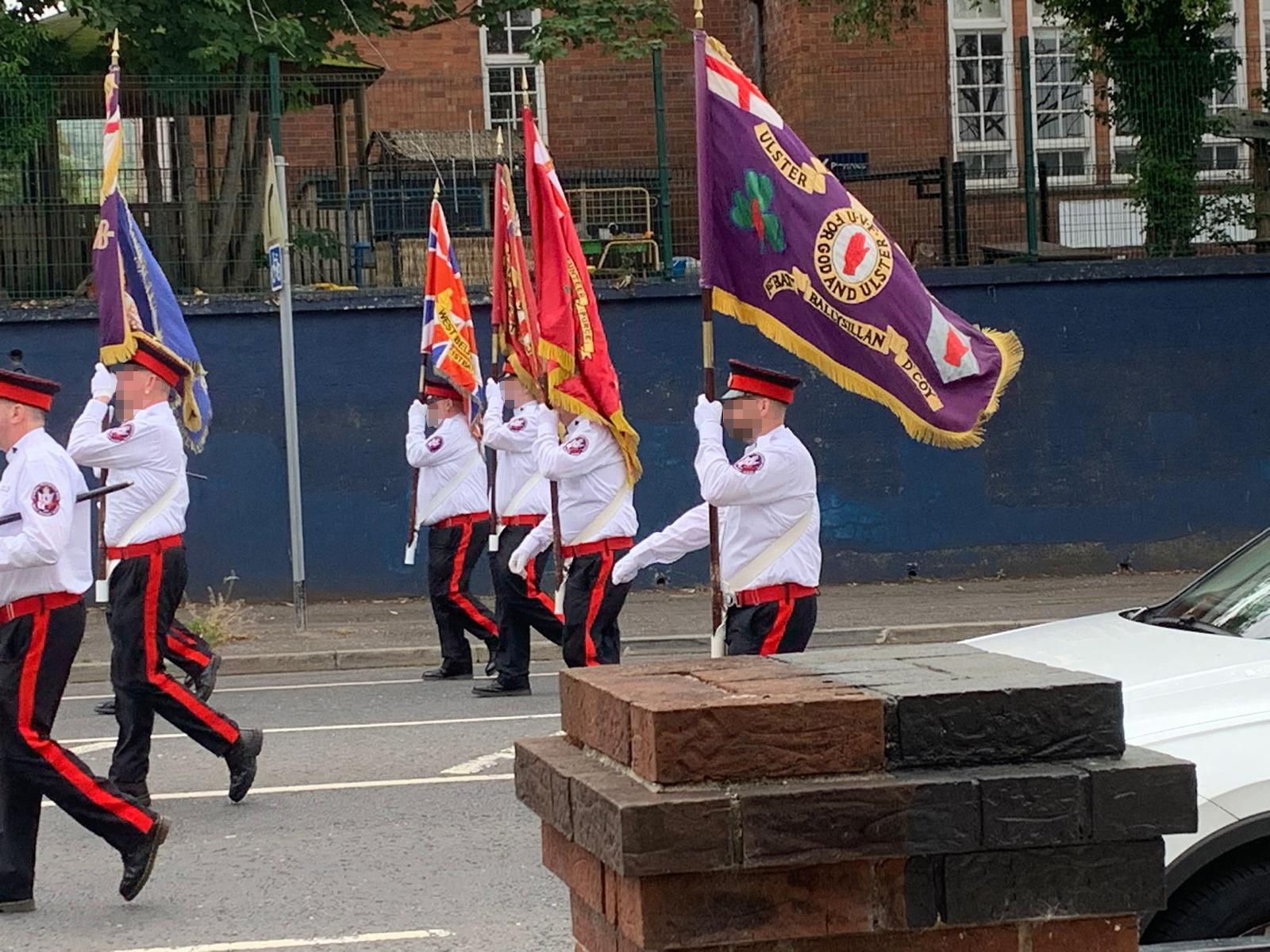 INVESTIGATION: Flags on display at the Whiterock Parade outside Springfield Primary School