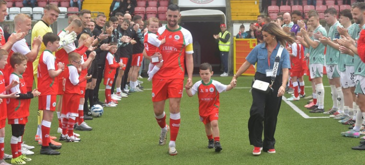 CELEBRATION: Joe \'The Goal\' Gormley takes to the pitch with his family at his testimonial on Sunday