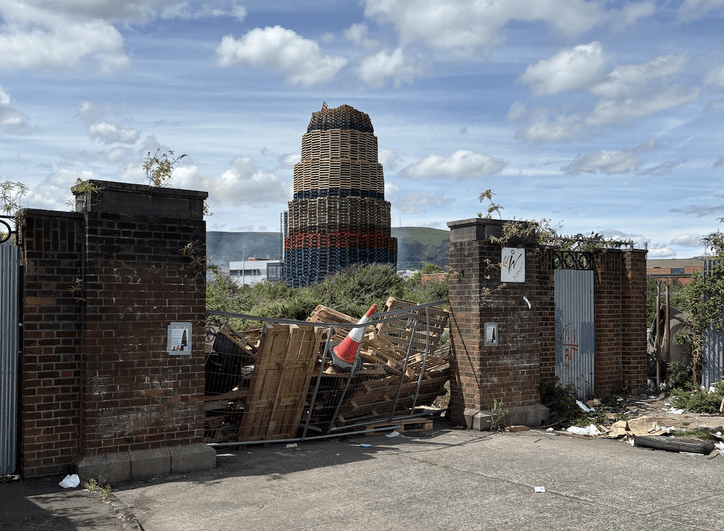 NO WAY IN: Pallets have been piled up behind the locked gates at the Maldon Street entrance to the asbestos bonfire site
